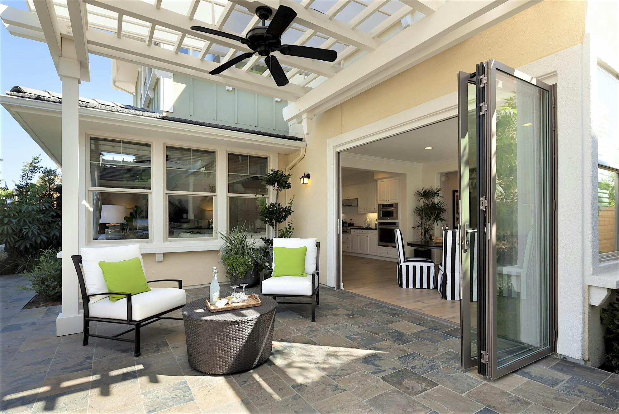 replacing traditional patio doors with folding glass walls