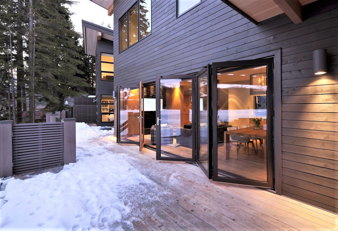 Folding glass walls replace a patio door and perform in harsh weather