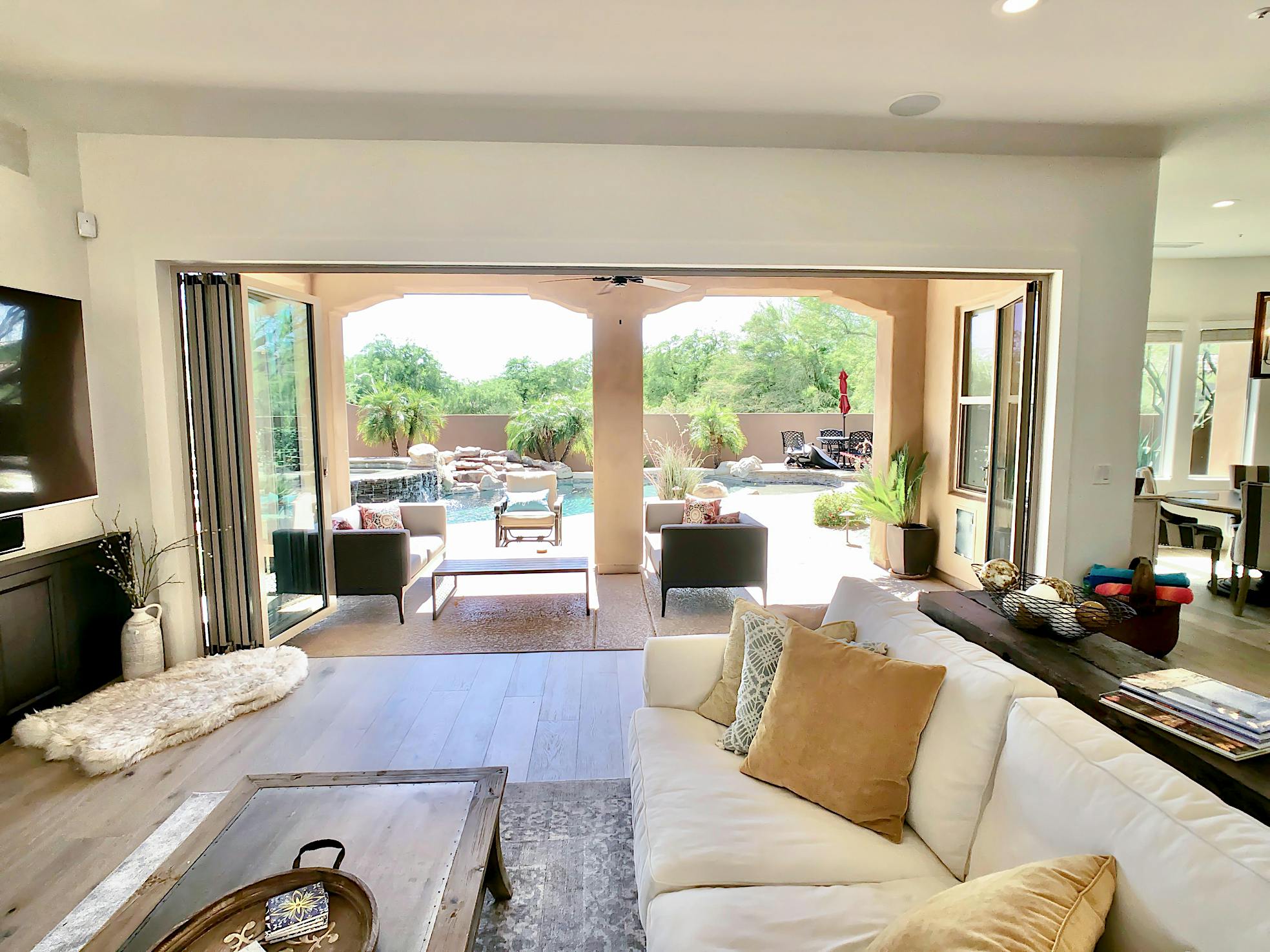 view out of remodeled family room through a folding glass wall