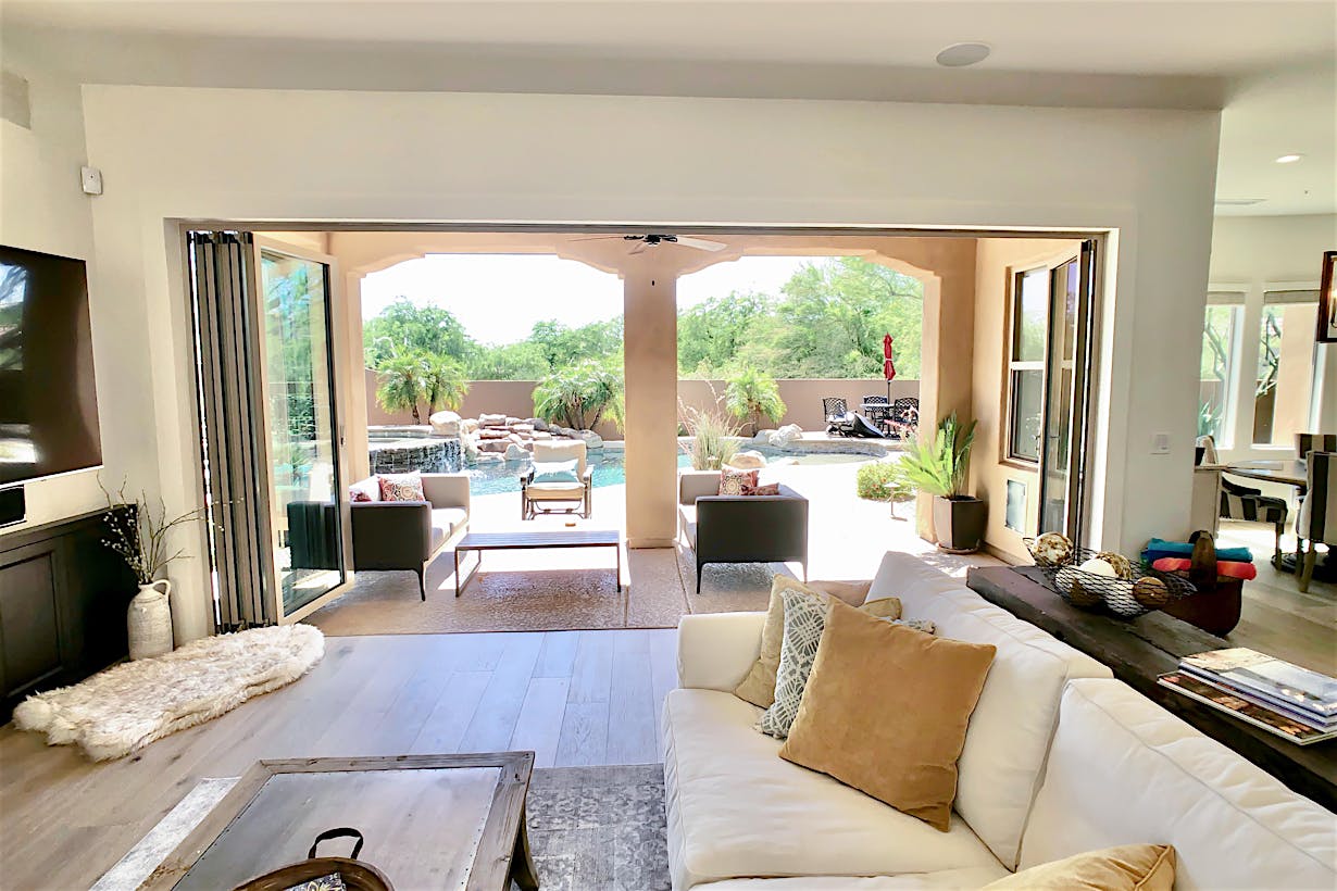 view out of remodeled family room through a folding glass wall