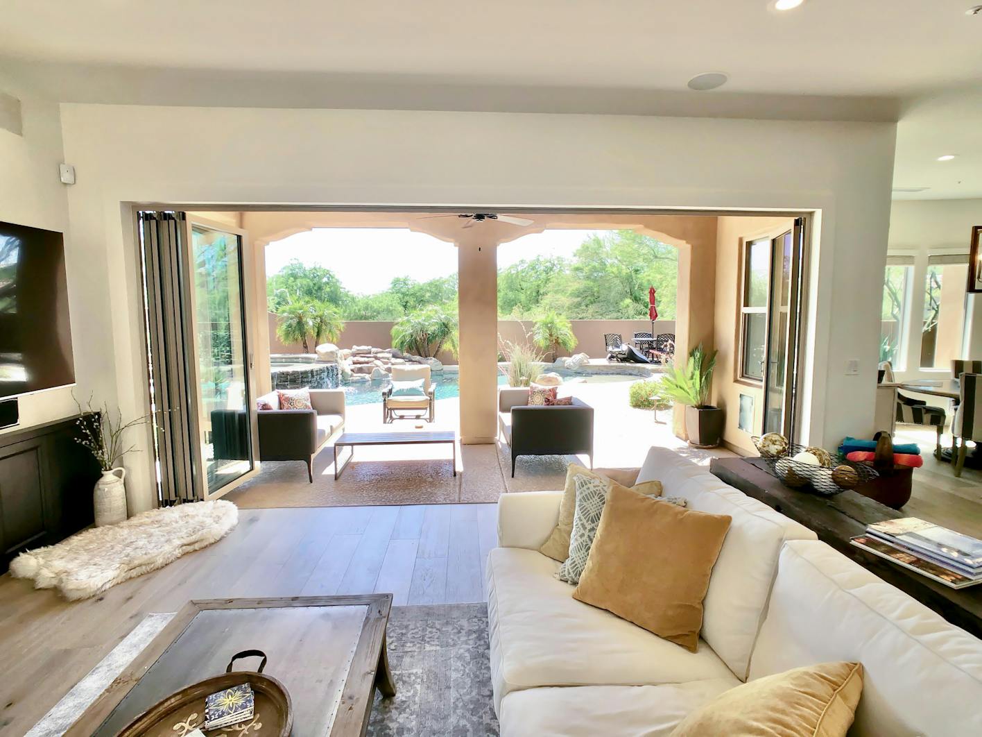 view out of remodeled family room through a folding glass wall