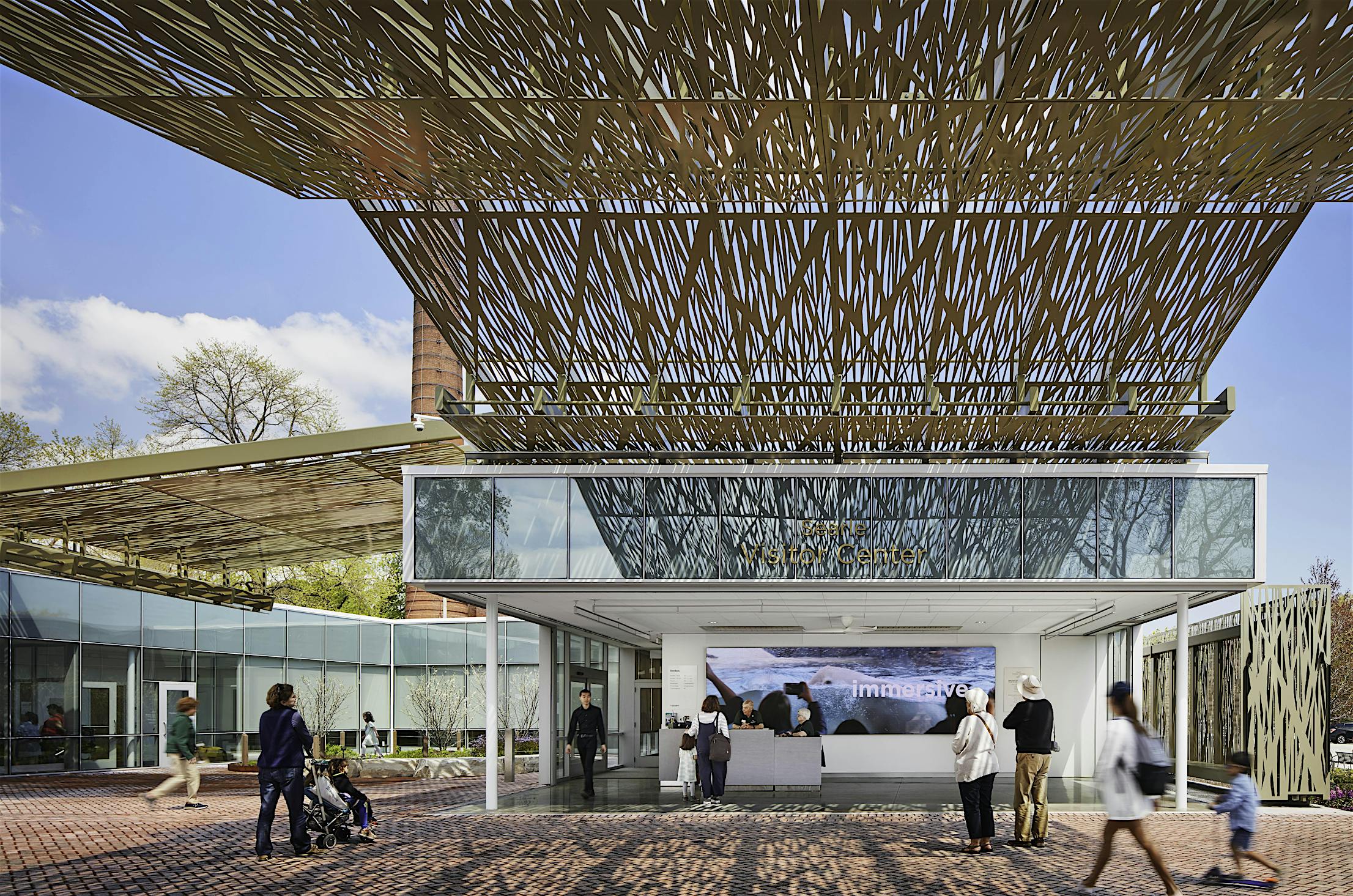 Stacking glass walls that completely disappear at Lincoln Park Zoo's Visitor Center