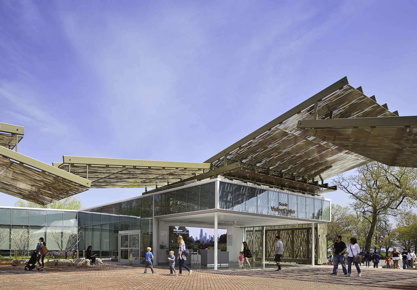 New visitor center with cantilever canopy and disappearing glass walls