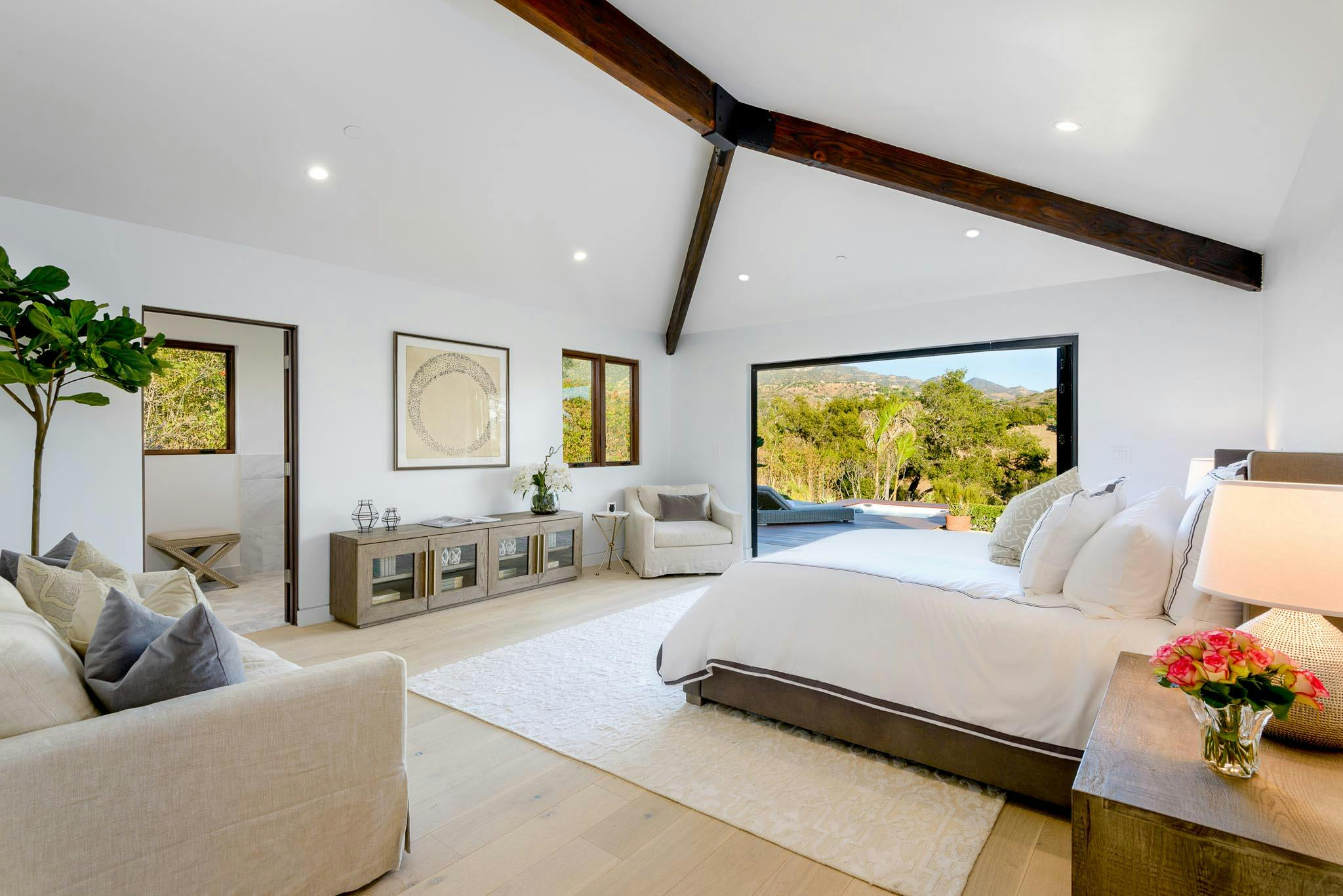 serene retreat in master bedroom in contemporary ranch remodel with NanaWall FoldFlat system