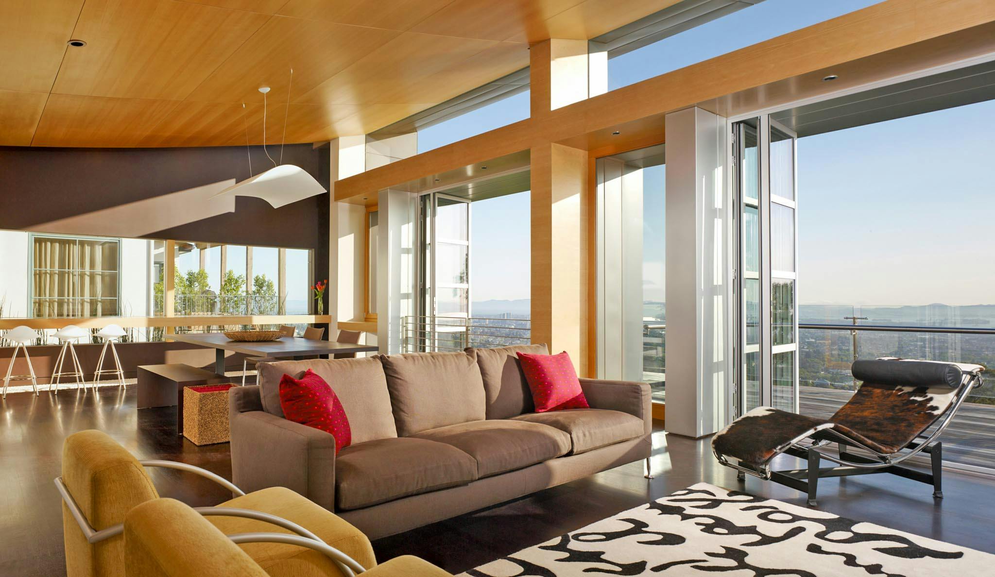 hillside modern home design inspiration with view through folding glass door