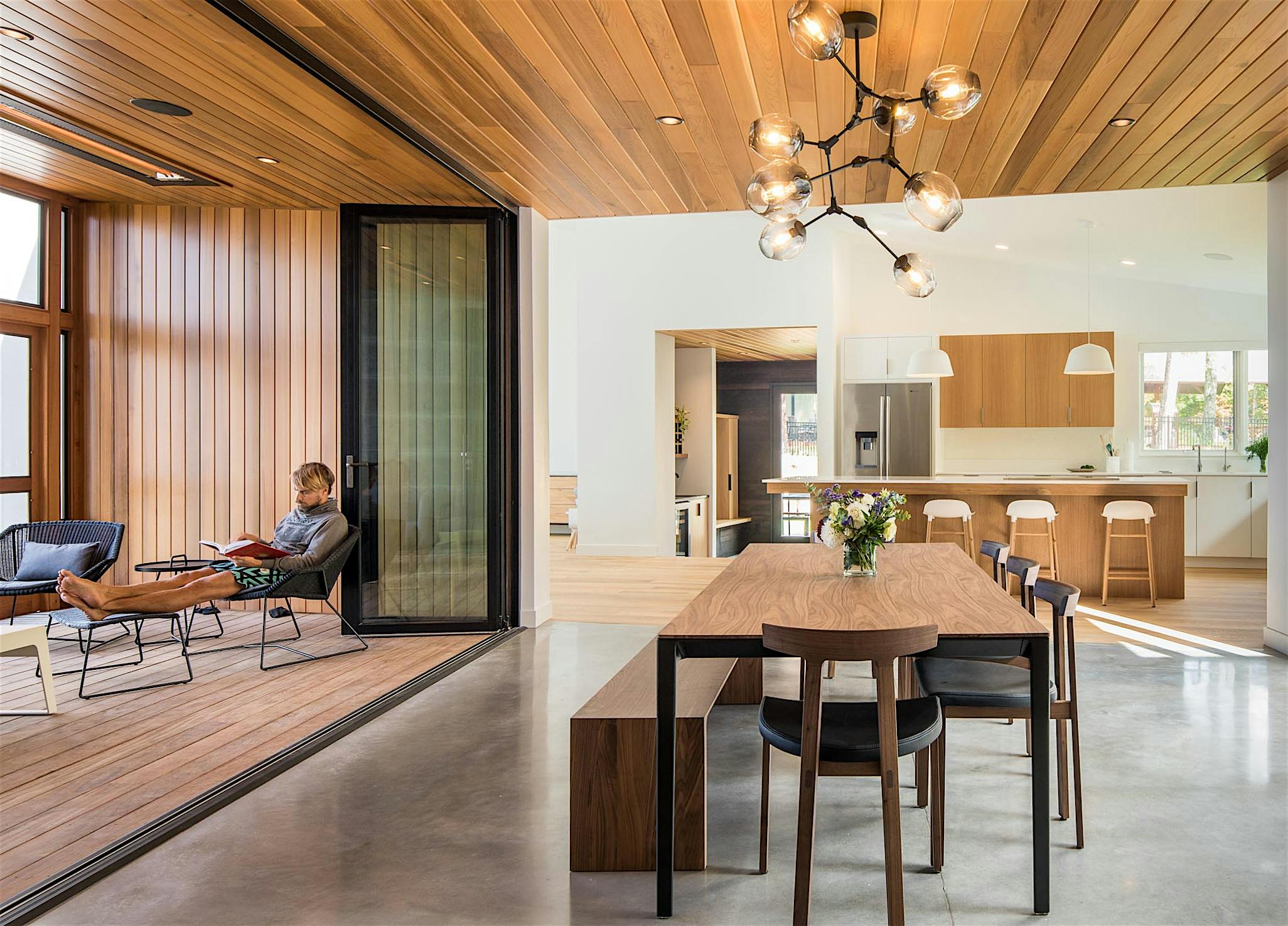 serene design inspiration in open concept living with folding glass wall