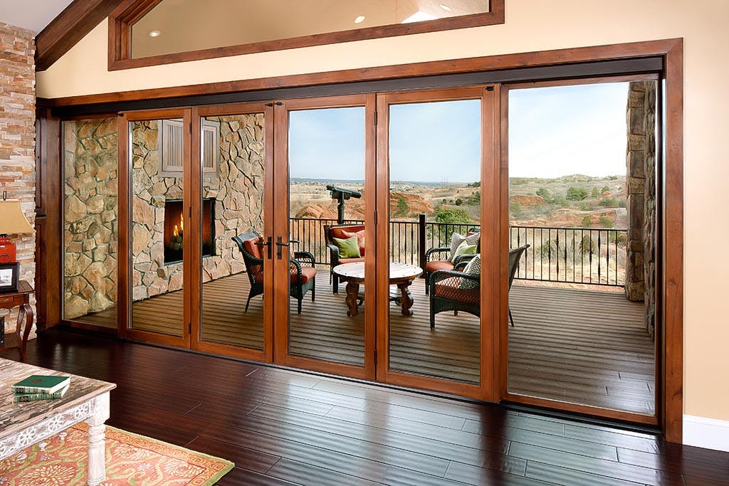 wood framed folding glass wall in traditional setting