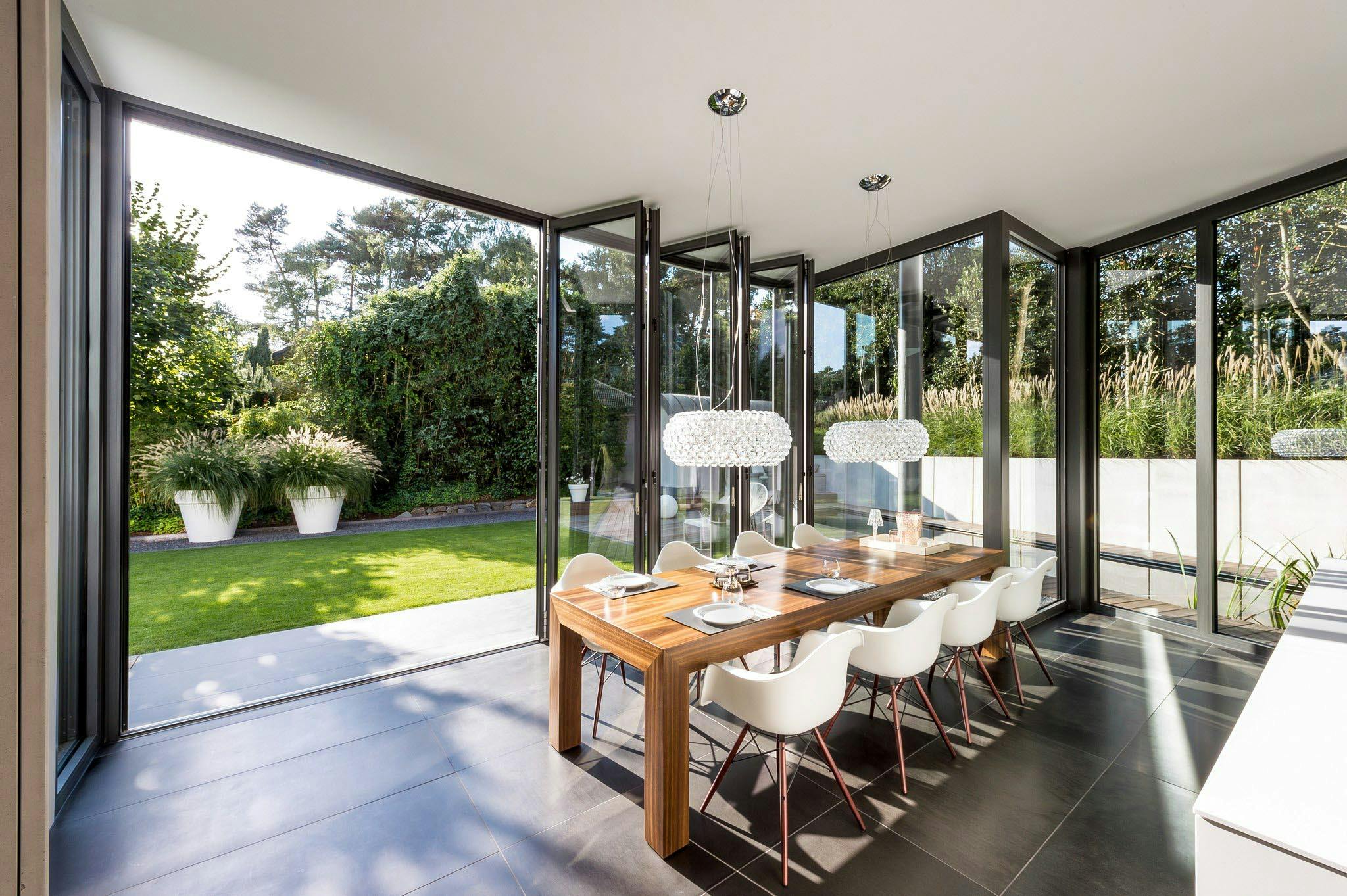 open concept living with folding glass wall to the outdoors