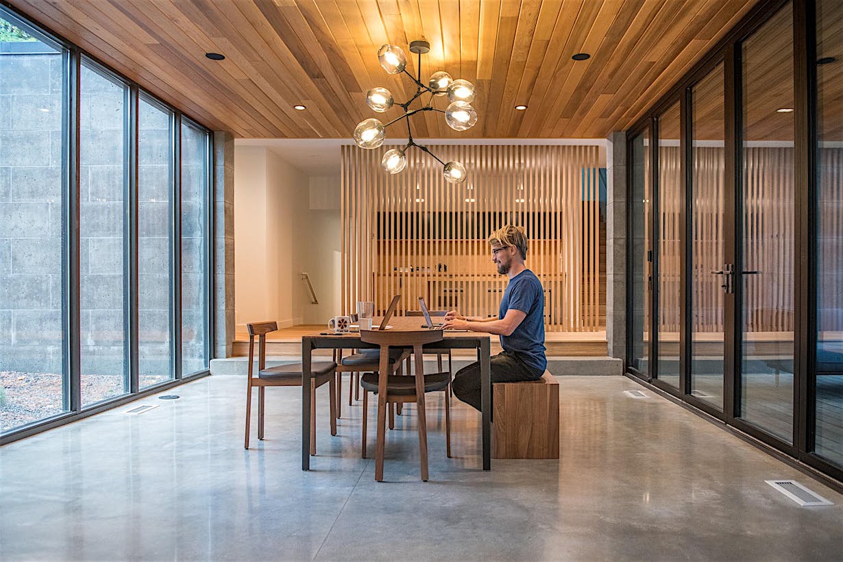 dining room becomes flexible work from home room with folding glass wall