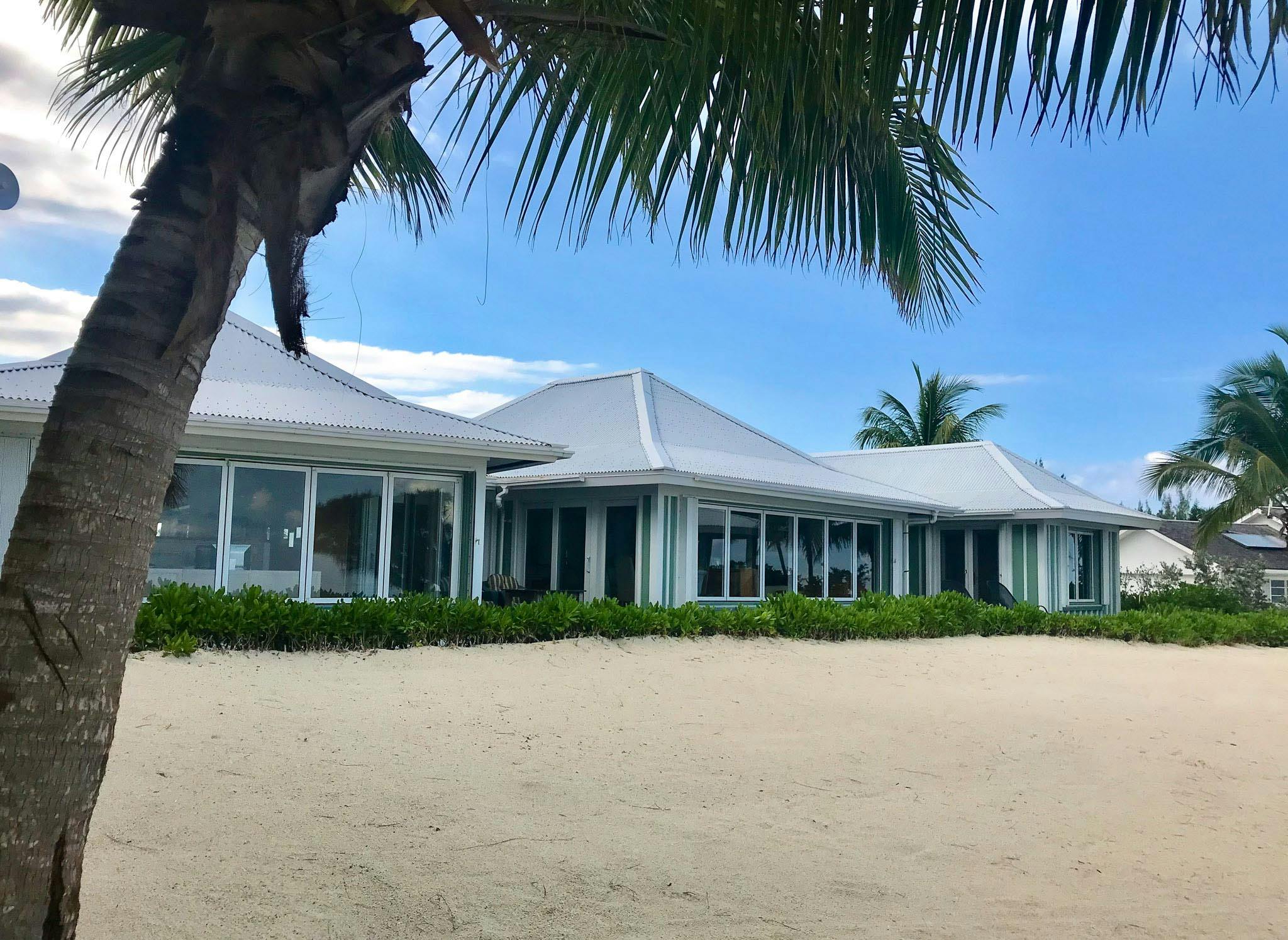 tropical beachfront home with folding glass walls