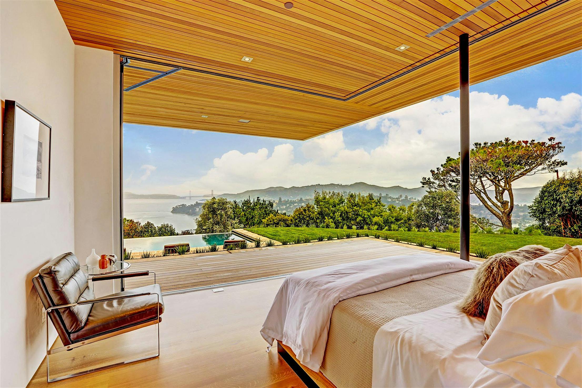 indoor/outdoor bedroom with open corner sliding glass wall