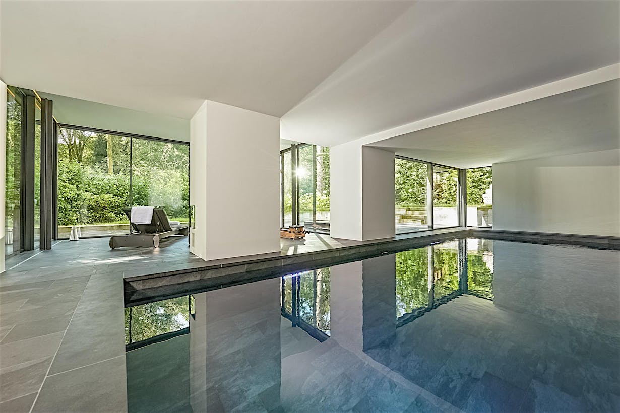 floor to ceiling cero minimal sliding glass walls in pool house