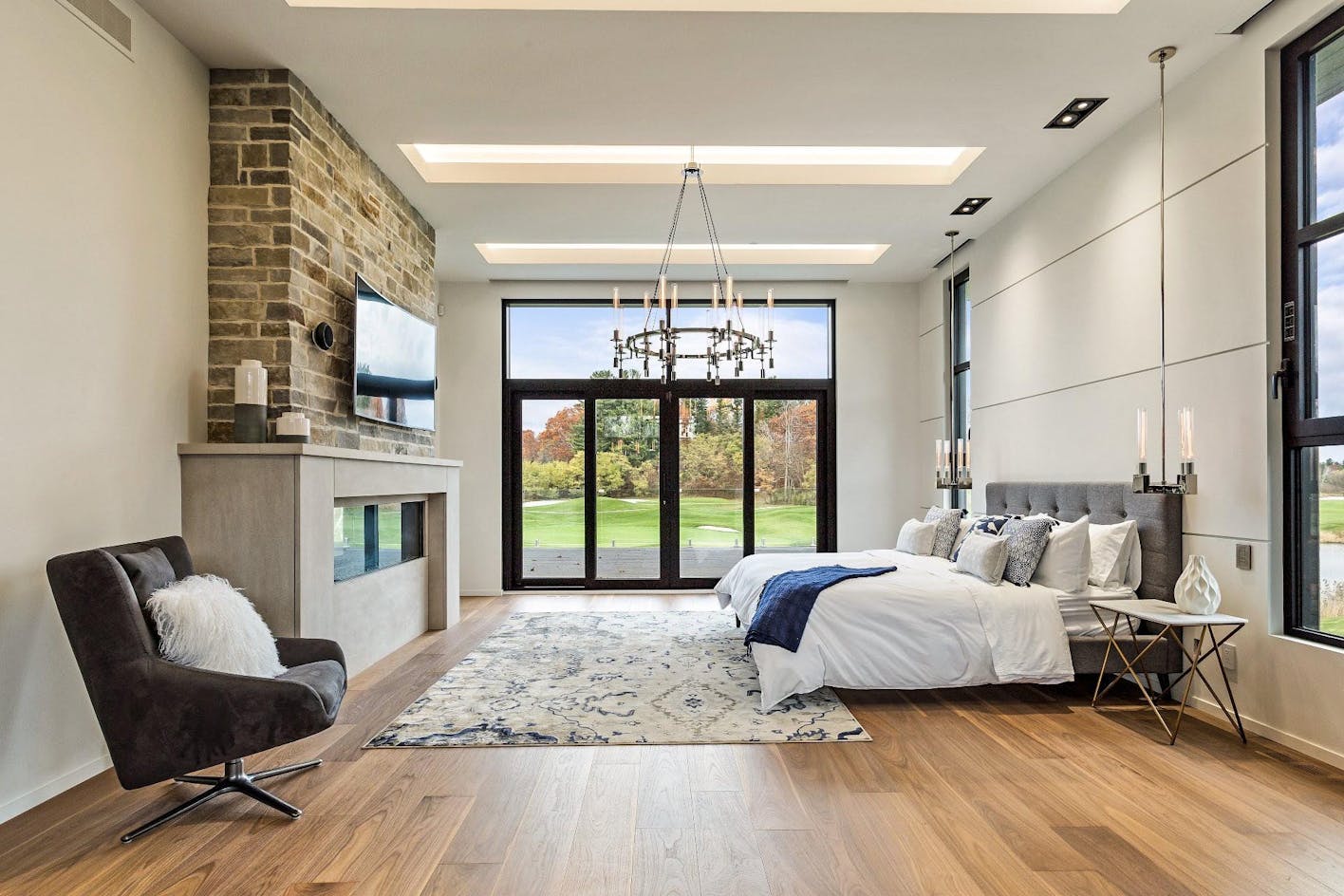 grand bedroom retreat with opening glass wall