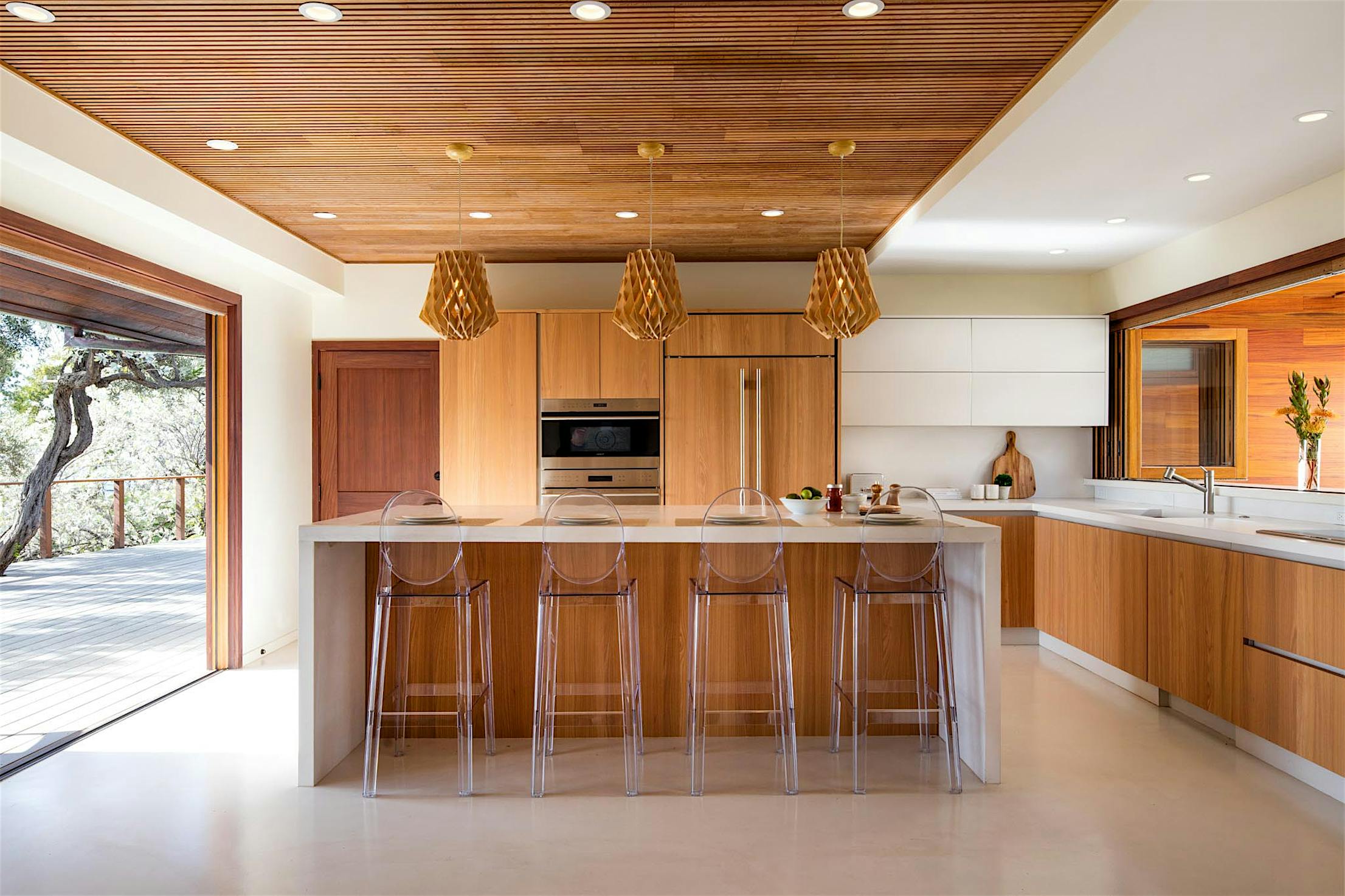 indoor/outdoor kitchen with two wood folding glass walls