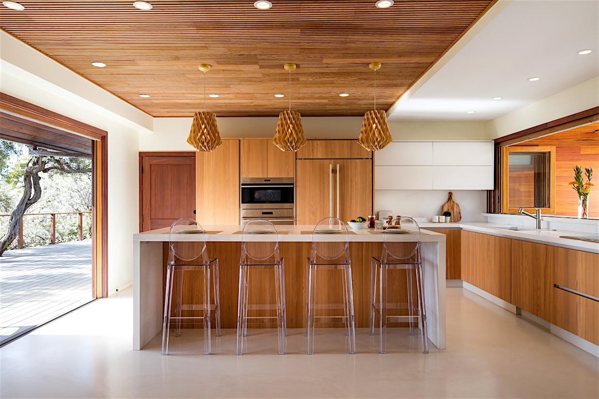 indoor/outdoor kitchen with two wood folding glass walls
