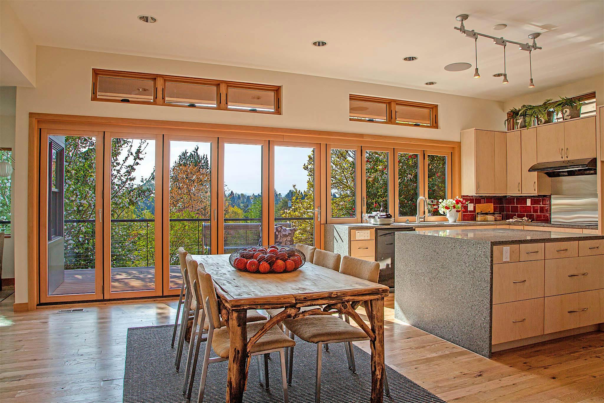 opening glass walls kitchen transition in wood in Seattle home