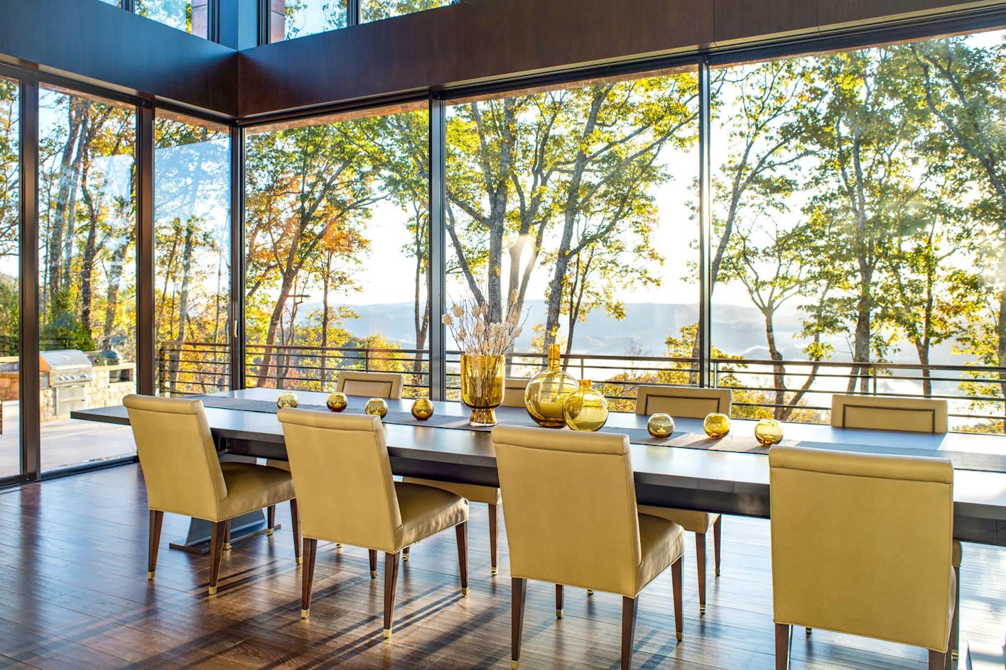 beautiful tree lined view in dining room through cero minimal sliding glass wall