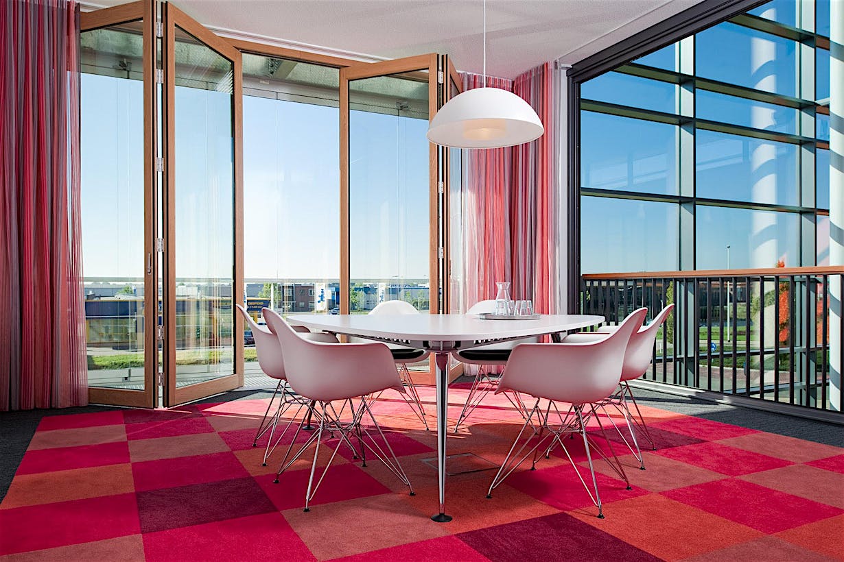 inside an office with folding glass wall and double skin with frameless glass wall for breathable building design