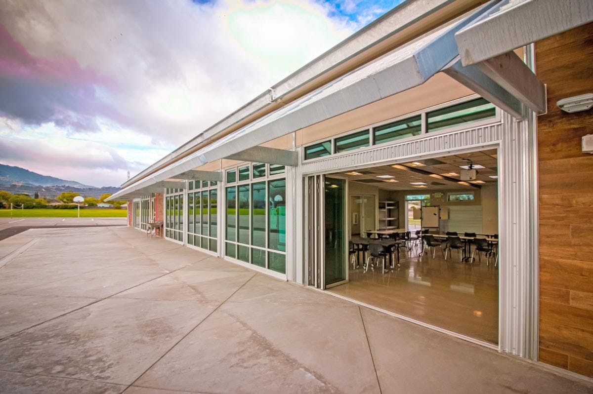 STEAM modular school buildings with folding NanaWall door to extend classroom to outside