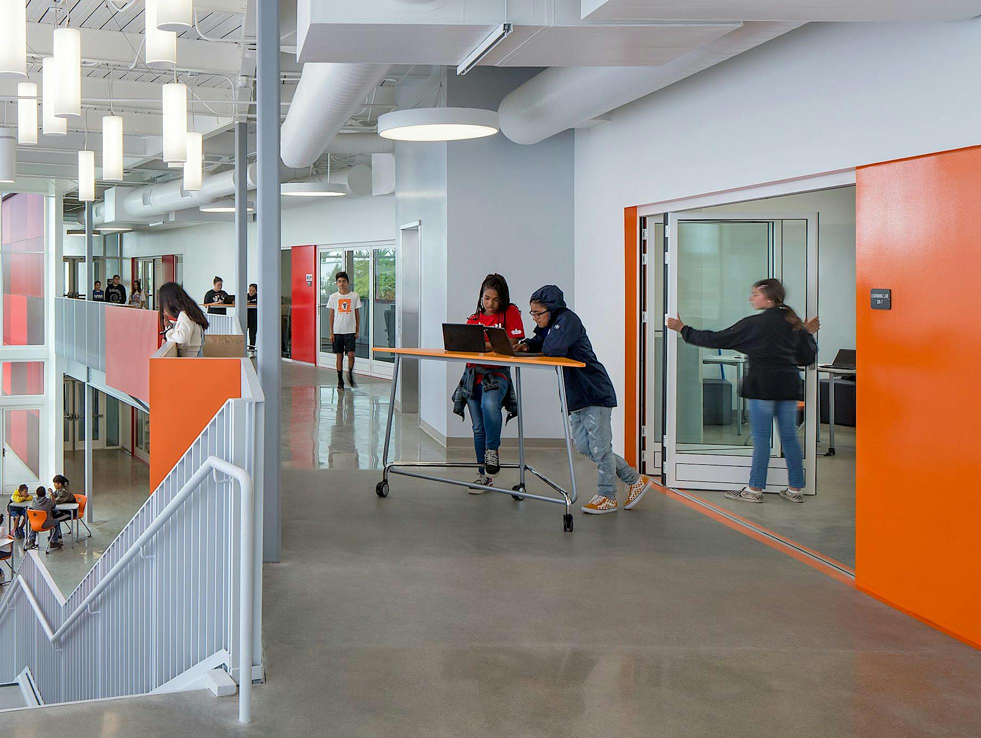 student opporating folding door in one of the 21st century classrooms at rio del sol academy