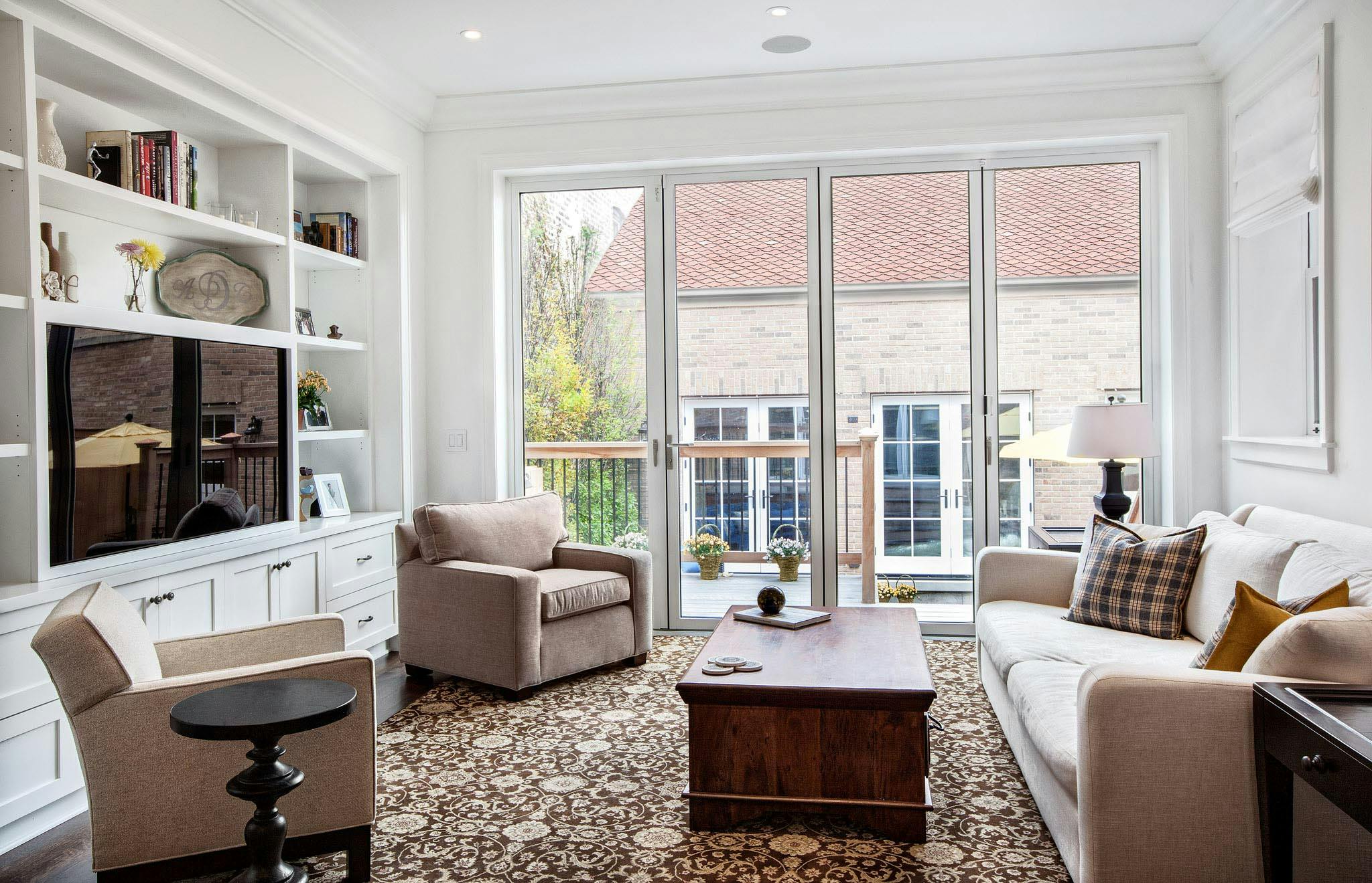 a chicago greystone living room remodeled with folding glass door for lots of daylight