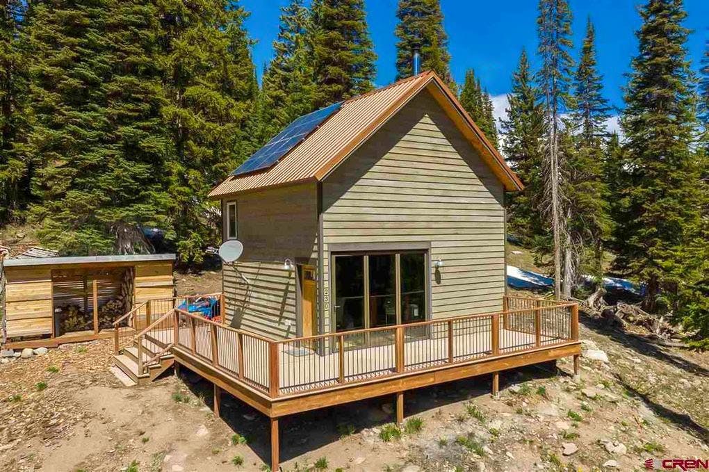 colorado tiny home with folding glass wall for daylight and views