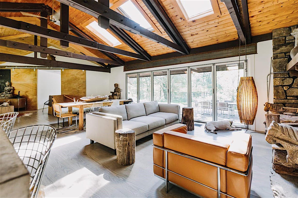 living room remodeled with vaulted ceiling and aluminum framed folding glass wall