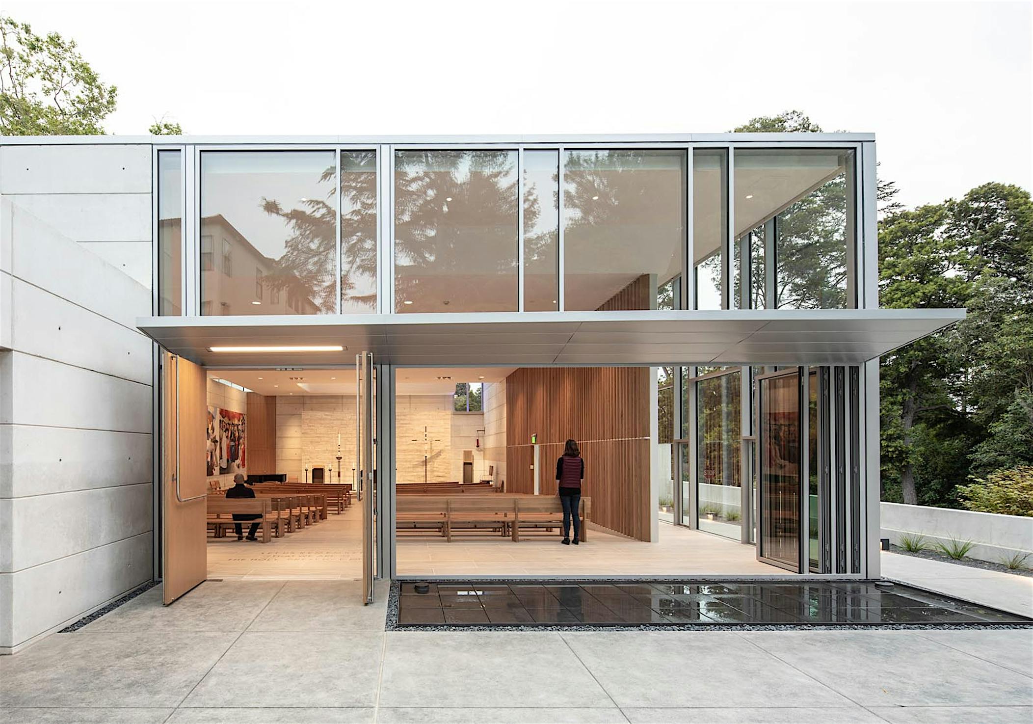 fresh air ventilation provides by opening glass walls in church design