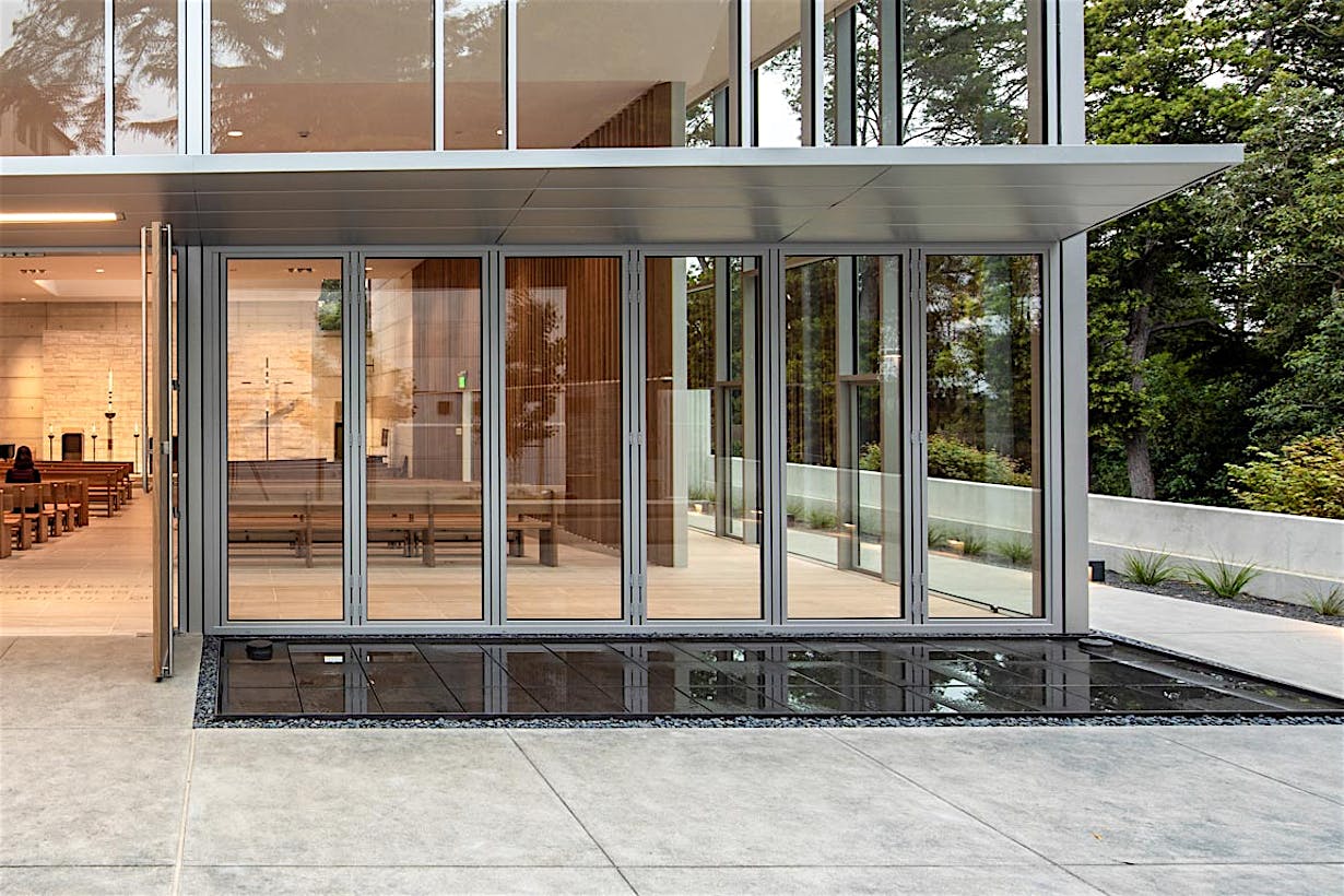closed folding glass wall at saint mary's college high school in its student chapel