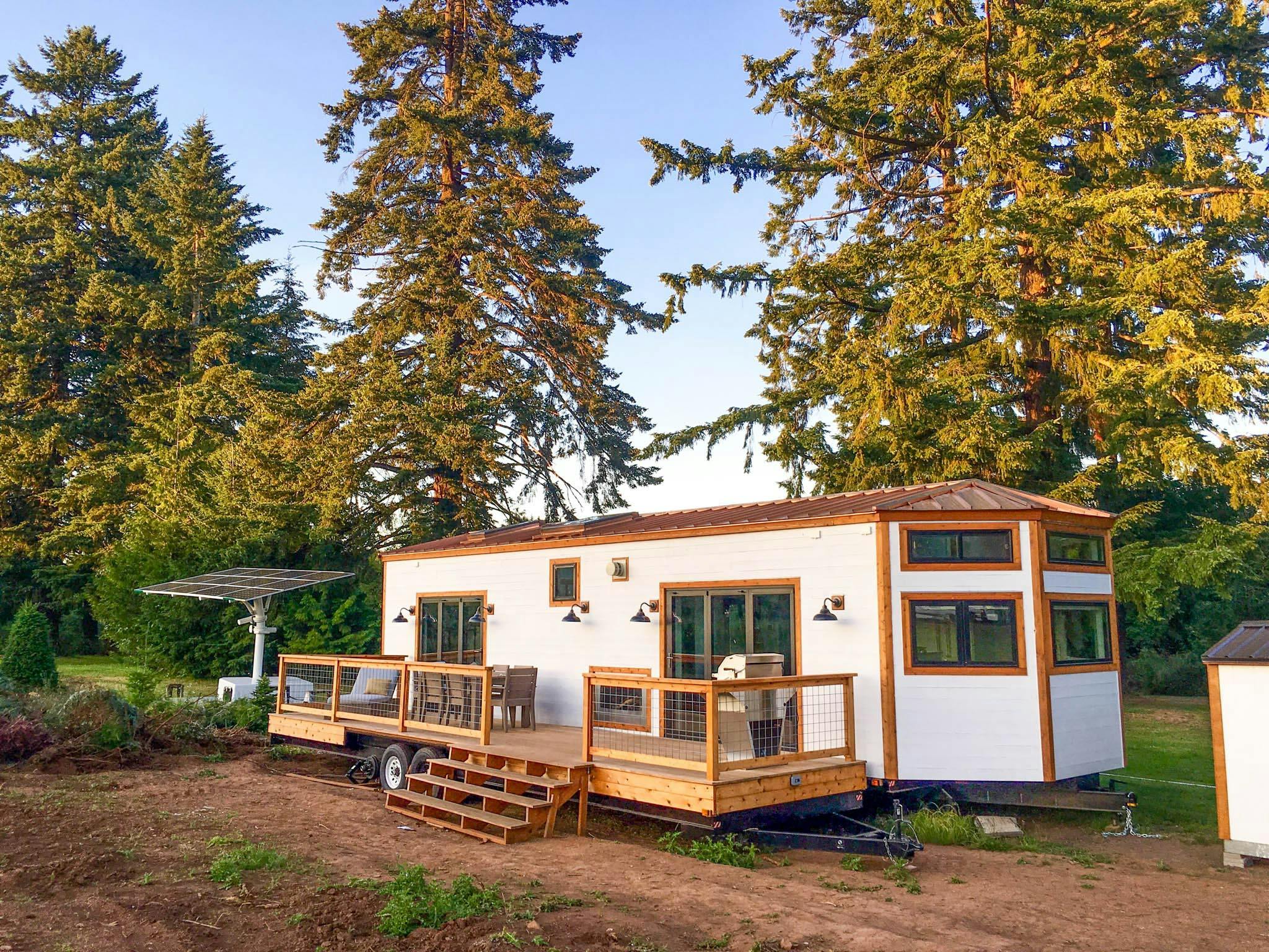 tiny home in Hawaii with two folding glass walls that open to deck