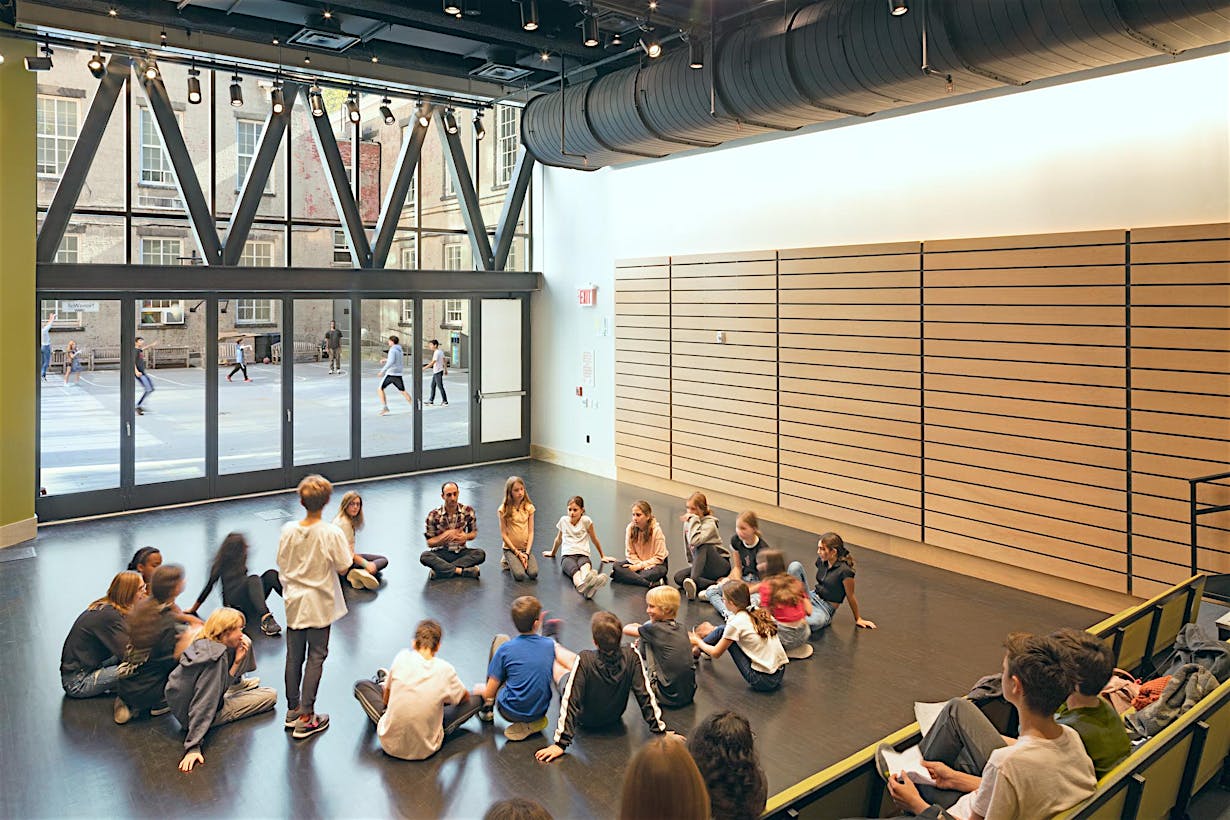 Friends Seminary great room with students in front of bifolding glass door