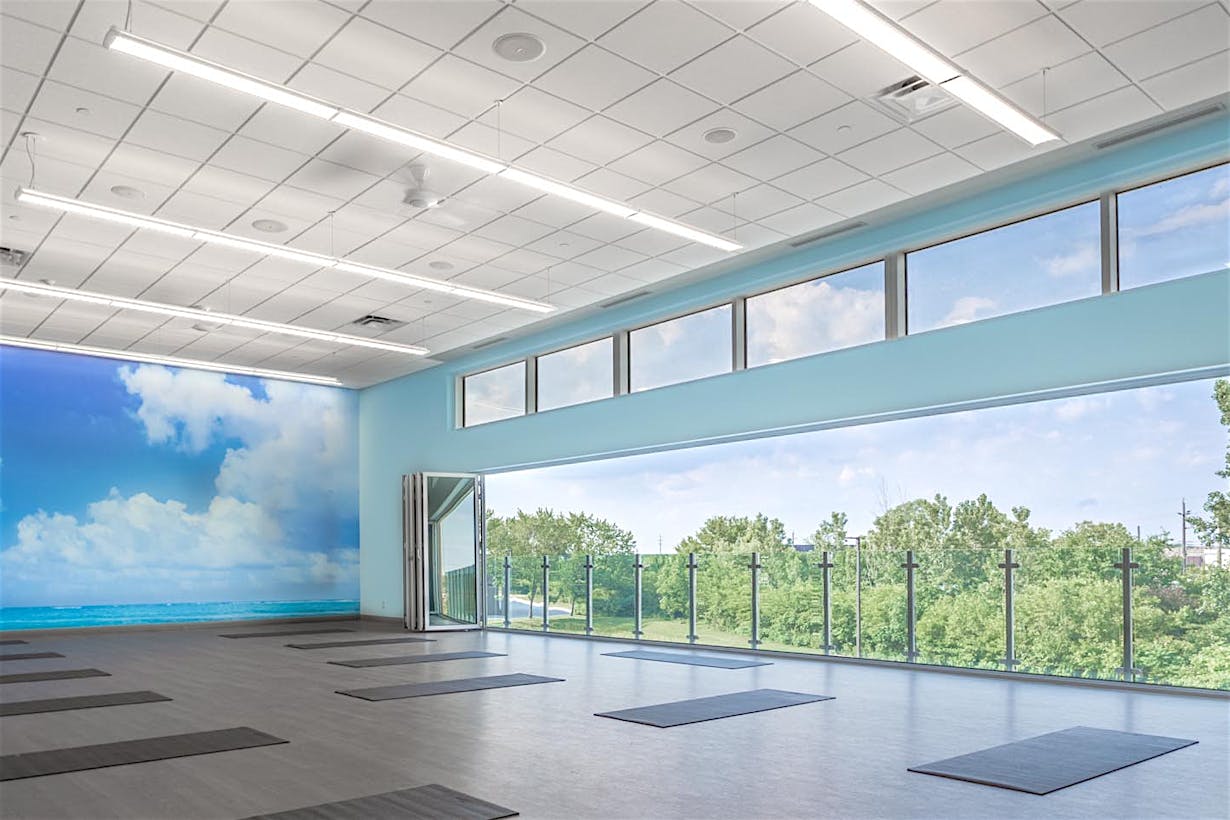 Fitness center design for health and wellness with opening glass walls