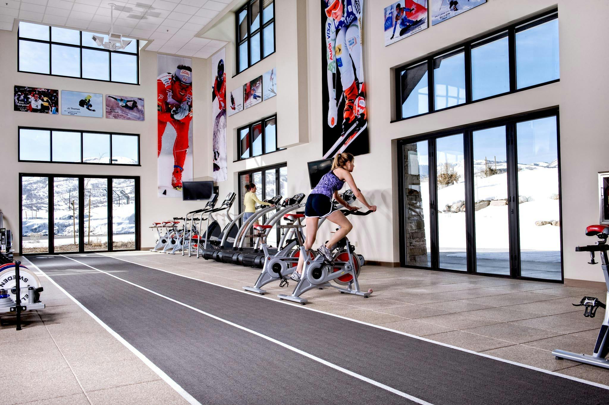 athletic training facility designed with folding glass walls