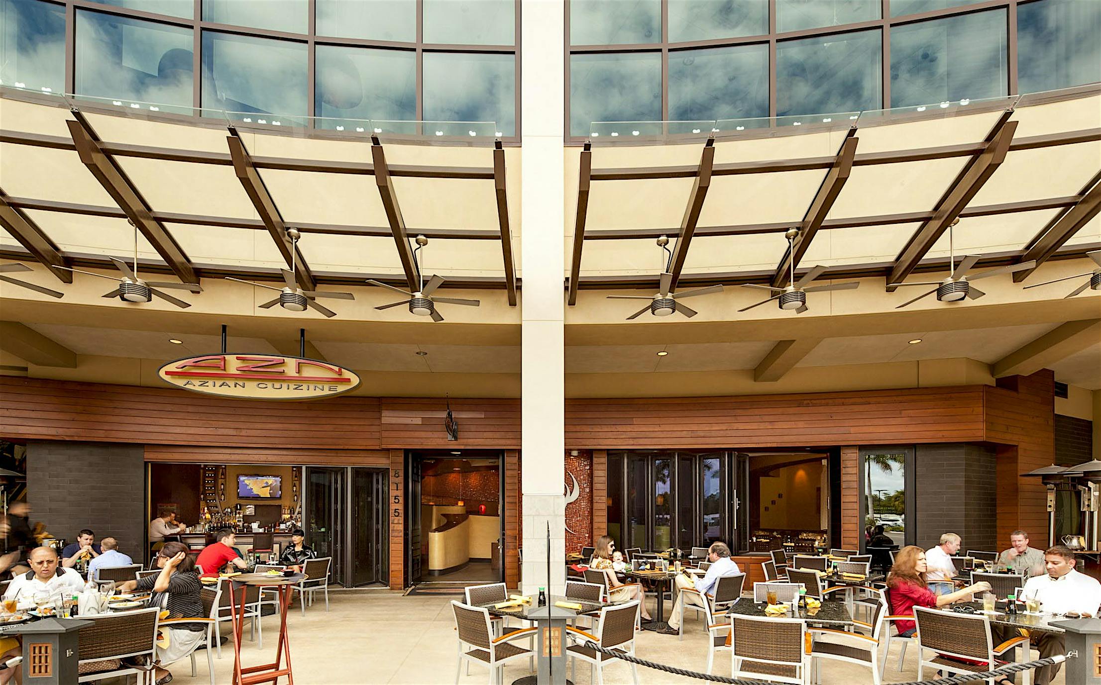 open restaurant design facilitates outdoor dining with moving glass walls