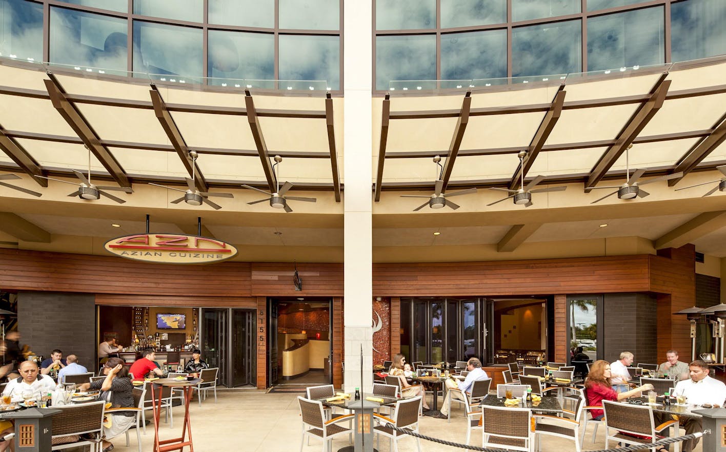 open restaurant design facilitates outdoor dining with moving glass walls