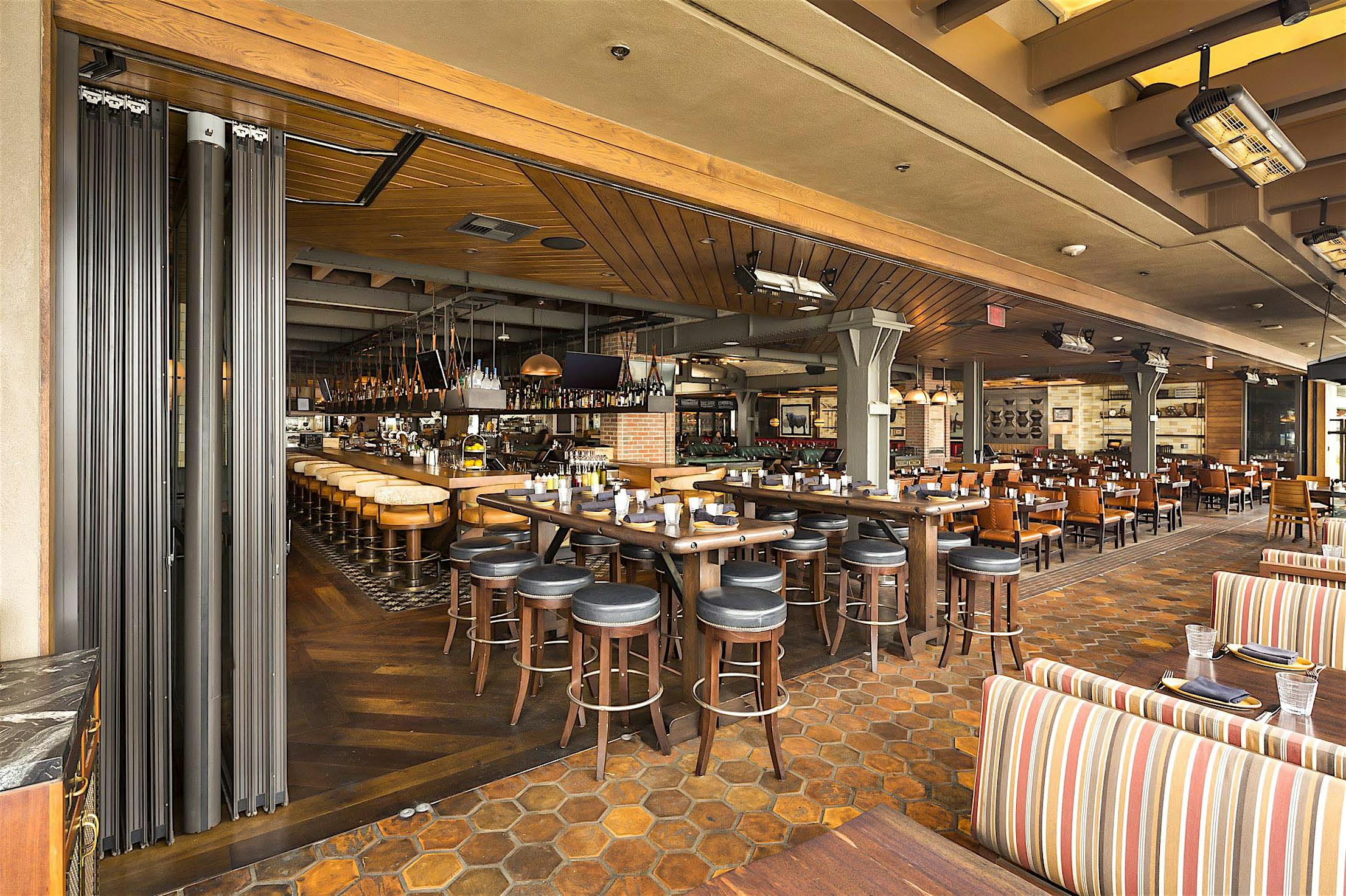 expanded seating with open restaurant design with commercial moving glass walls