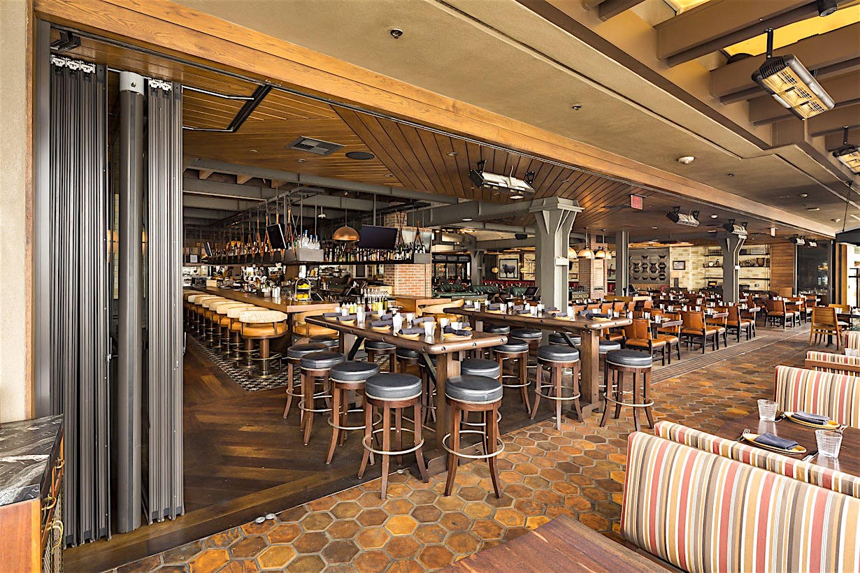 expanded seating with open restaurant design with commercial moving glass walls