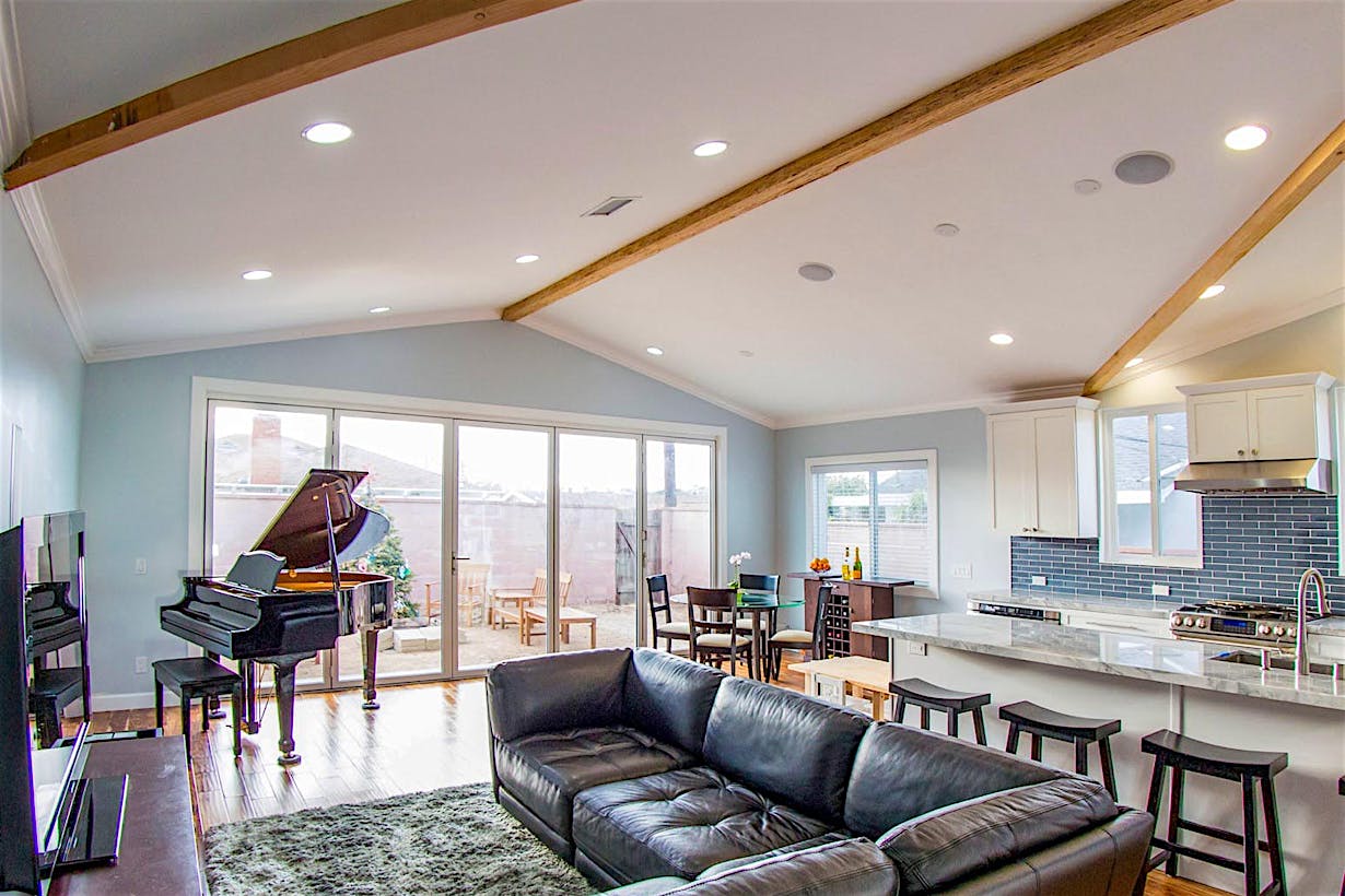 indoor/outdoor living space with operable glass wall
