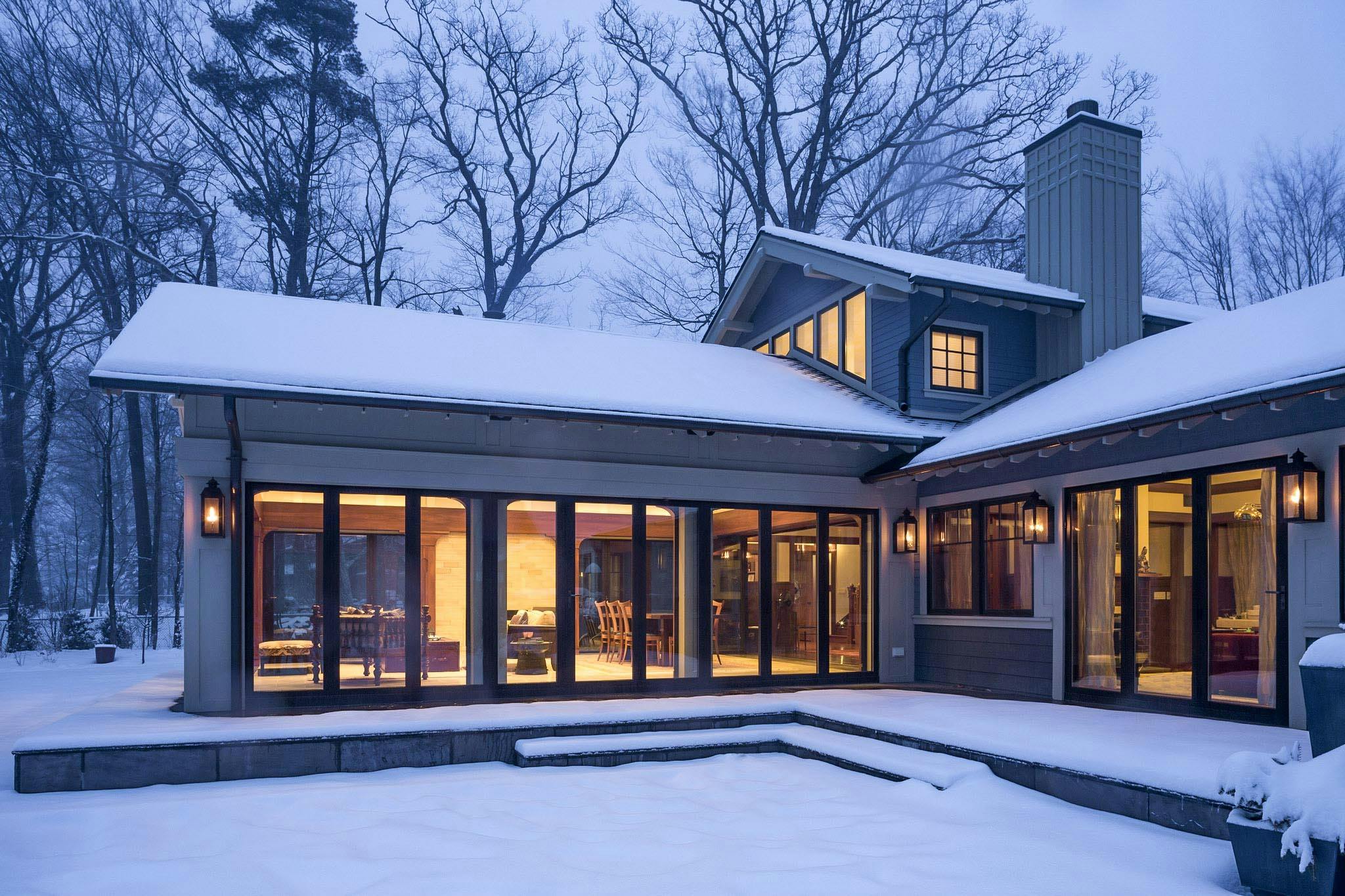 snowy winter getaway with operable glass walls