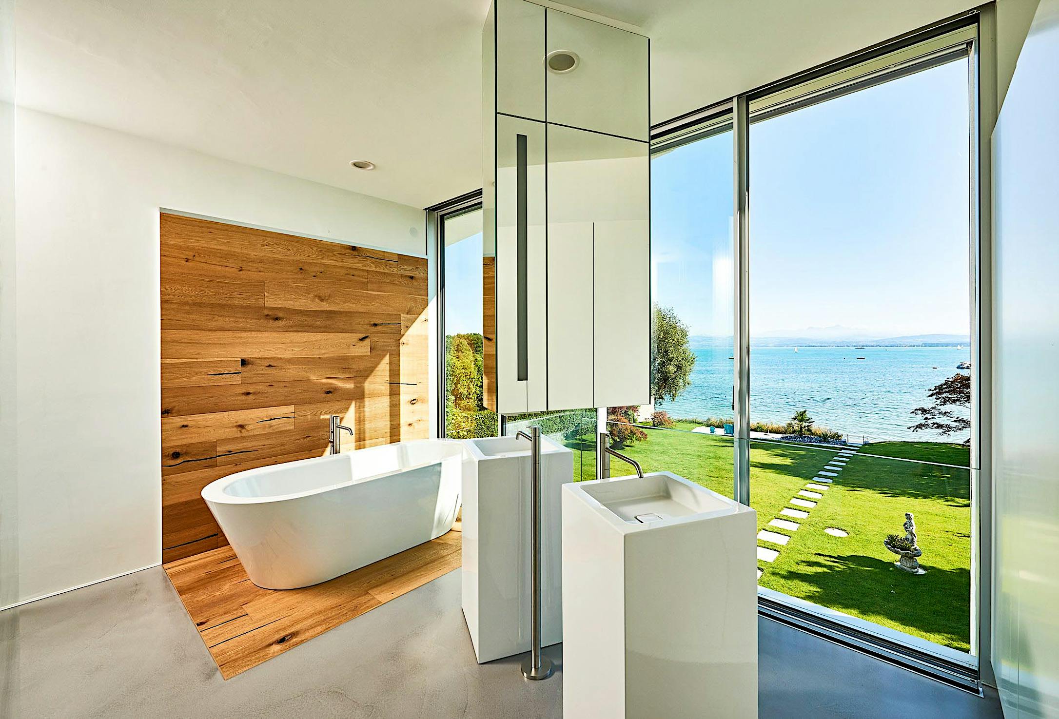 minimal framed retractable glass doors in bathroom
