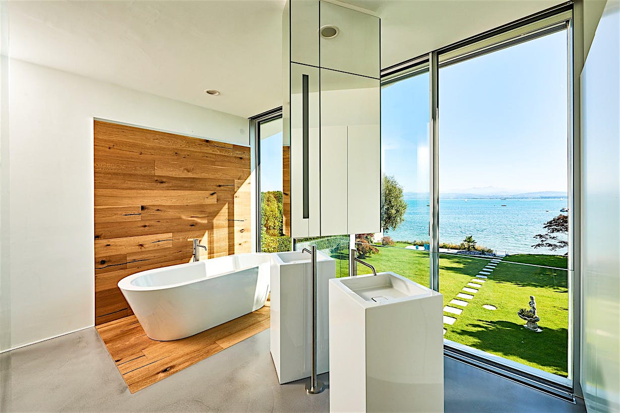 minimal framed retractable glass doors in bathroom