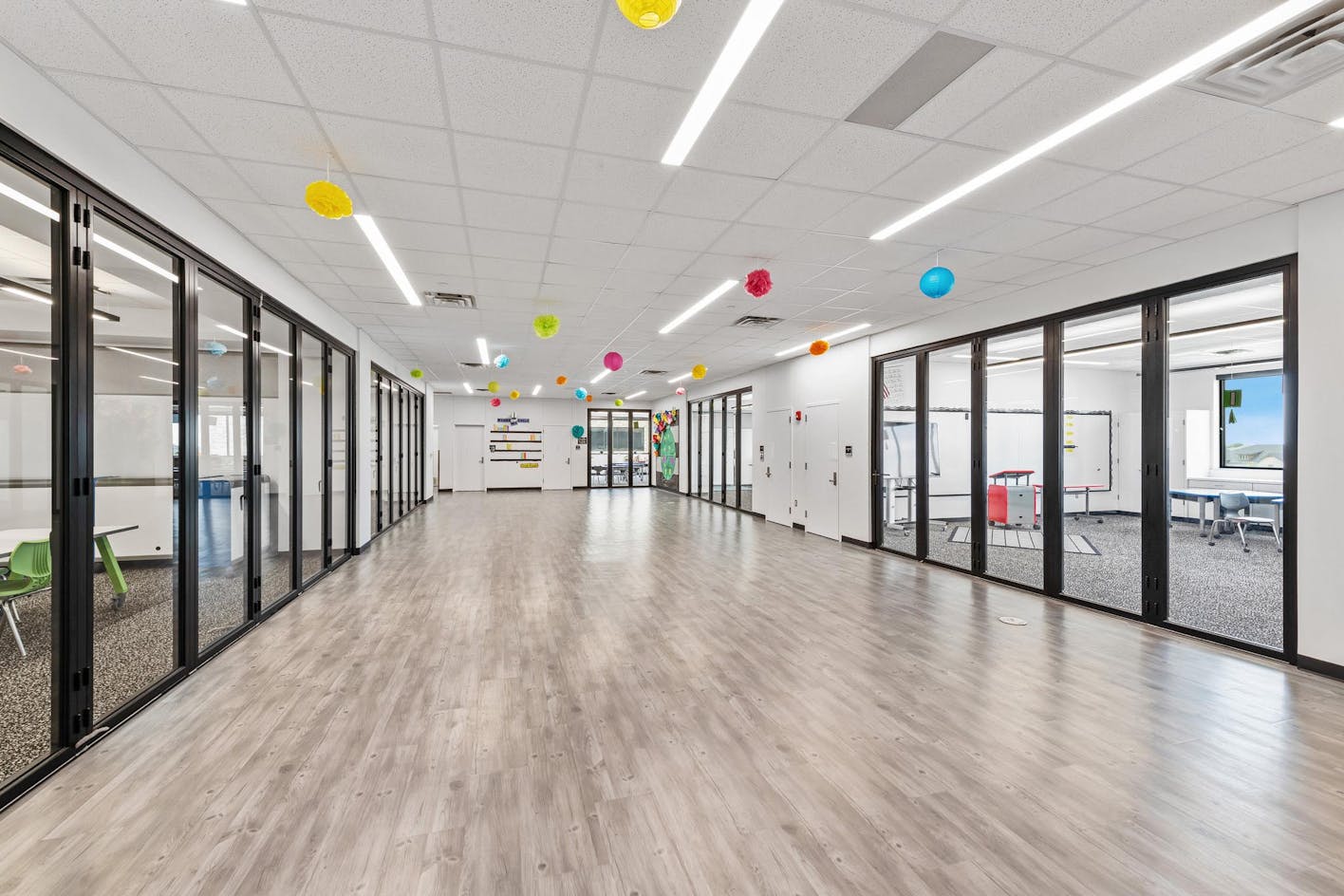 elementary school design with learning hubs and folding glass walls