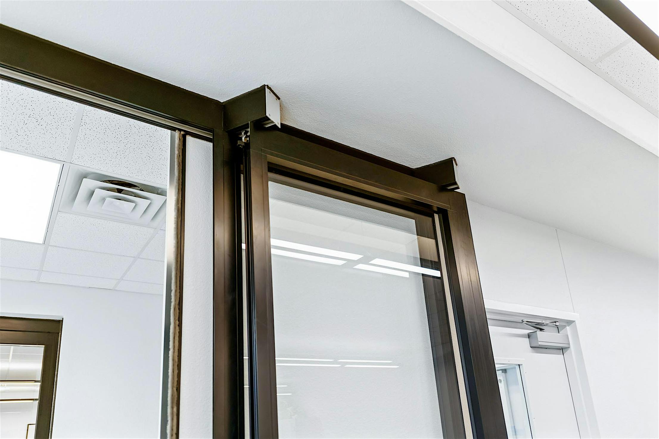 NanaWall HSW stacking glass doors park remotely in learning hub design