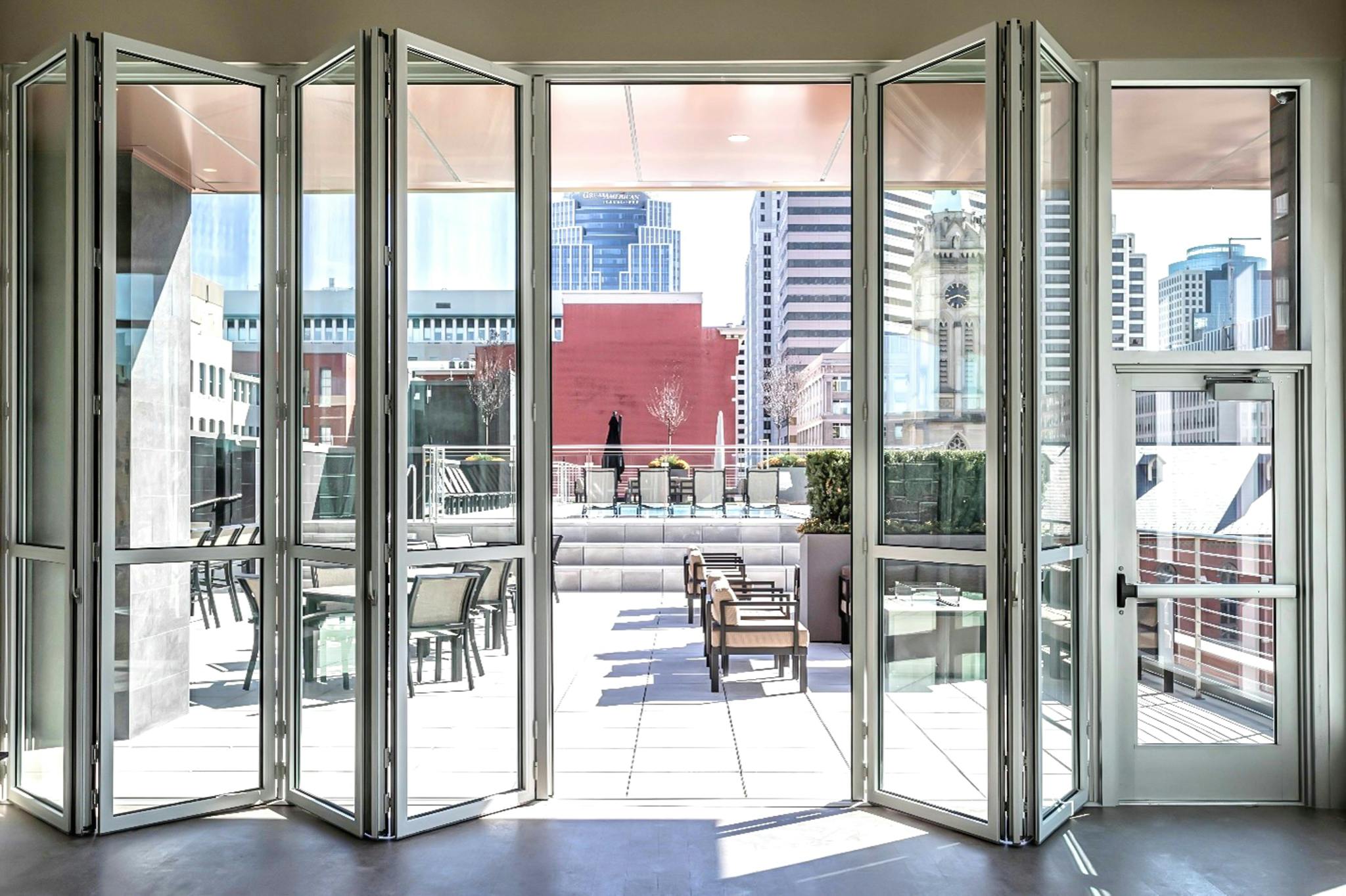 exterior moveable glass wall systems in multifamily rooftop application