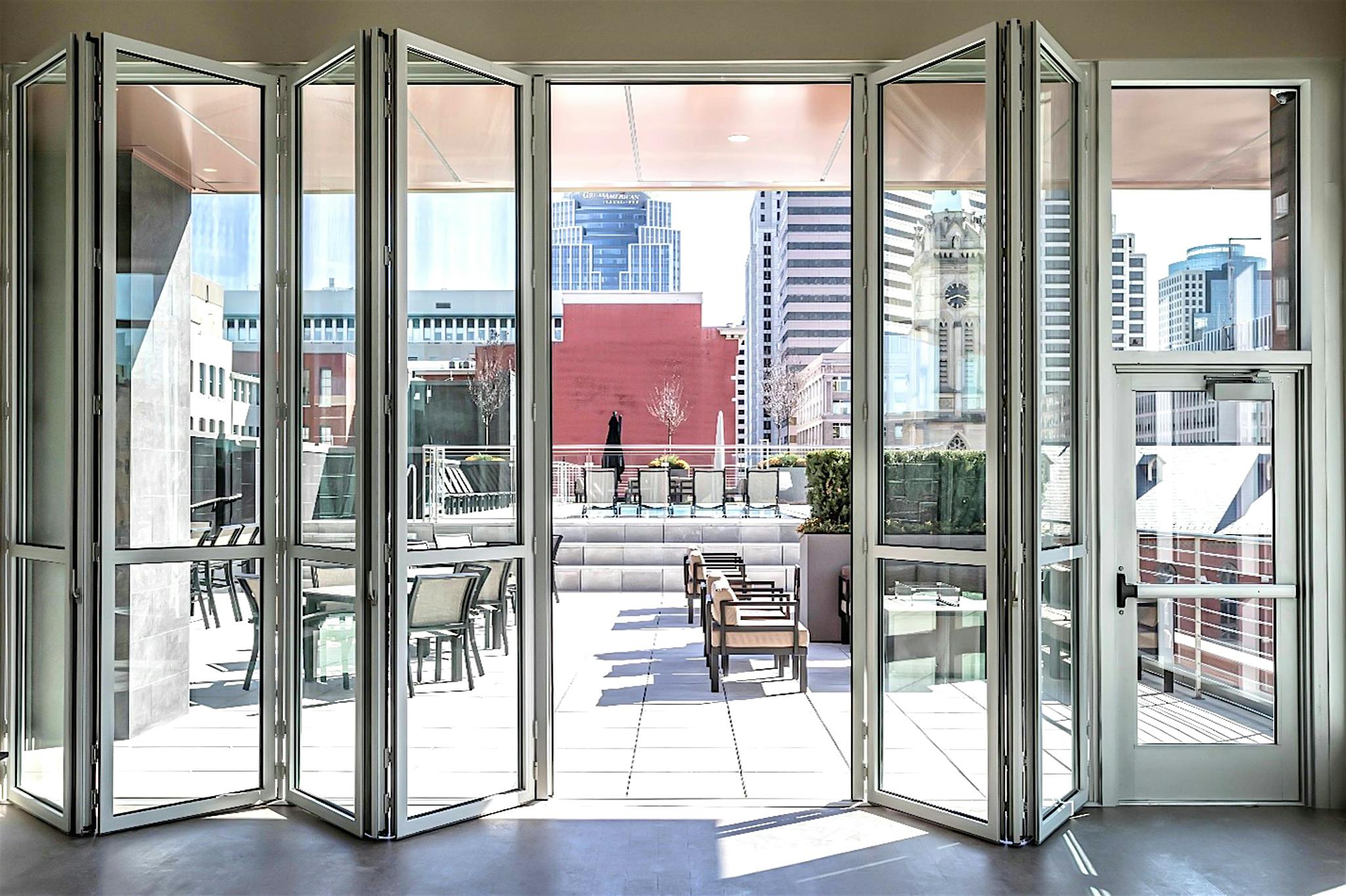 exterior moveable glass wall systems in multifamily rooftop application