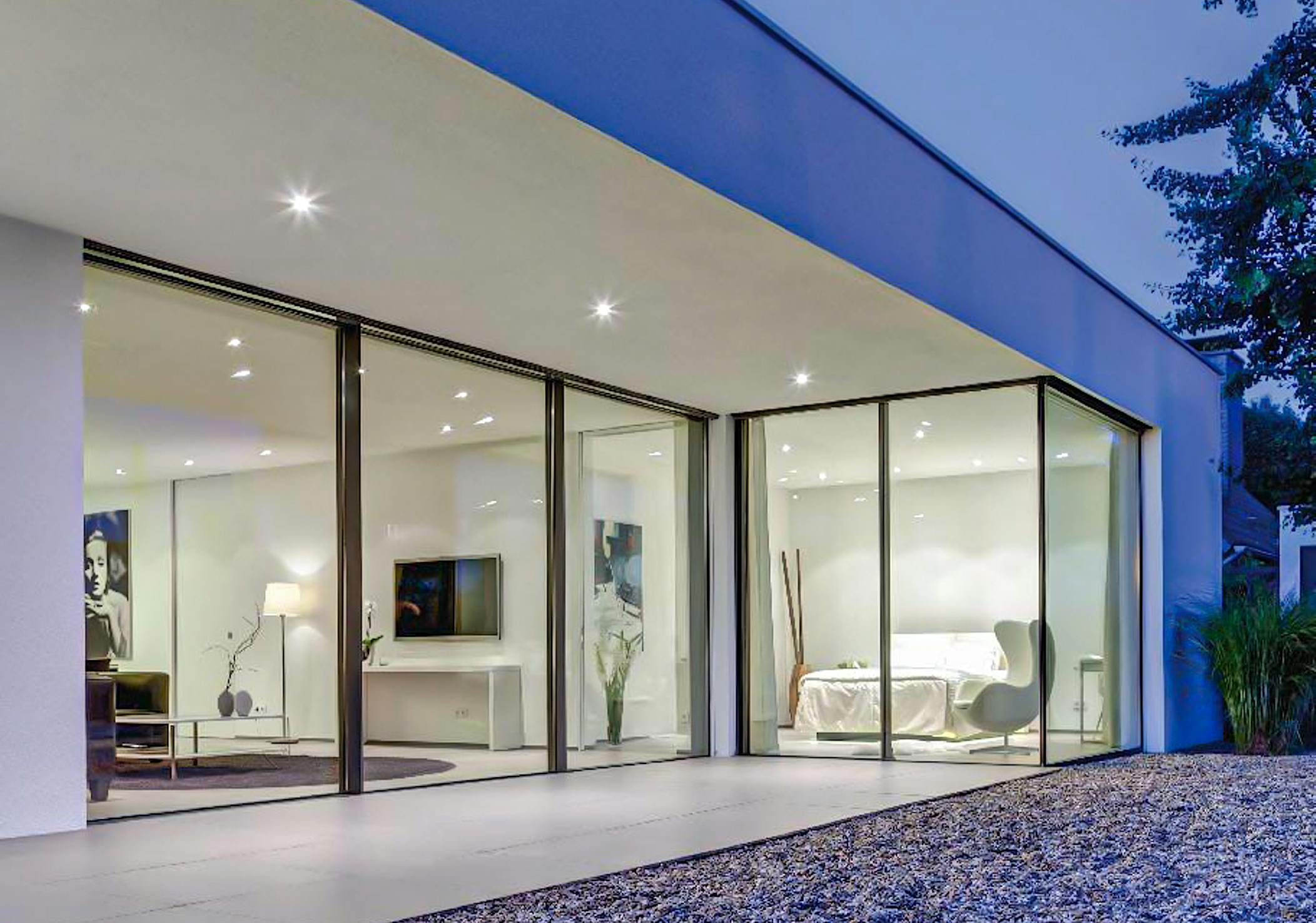 minimal exterior glass wall systems in modern bedroom