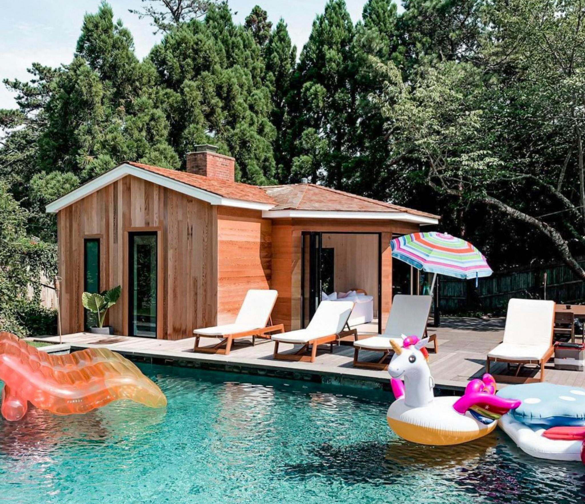 cool pool house with accordion glass doors