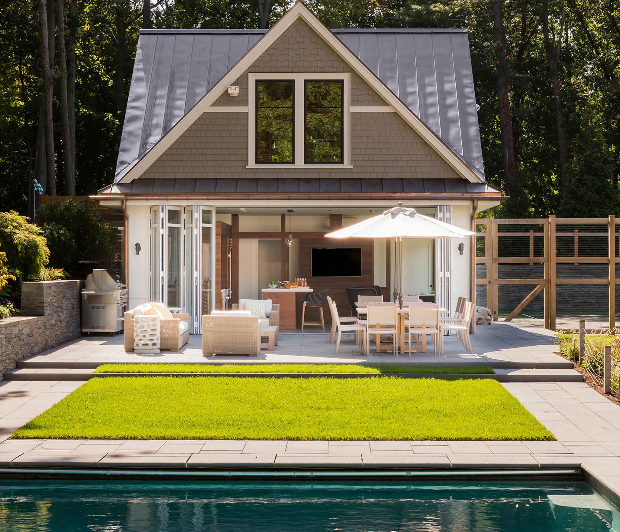 pool house with accordion glass doors