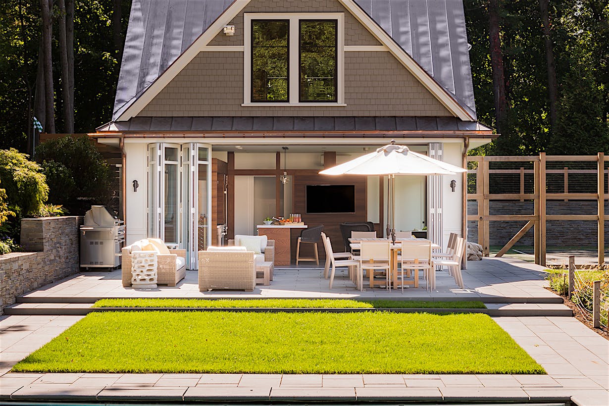pool house with NanaWall operable glass walls