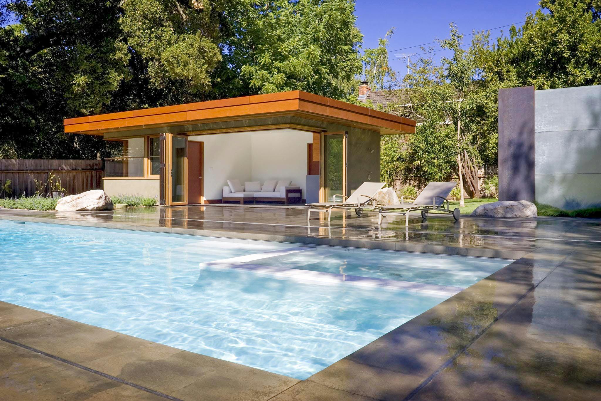 pool house with accordion glass doors